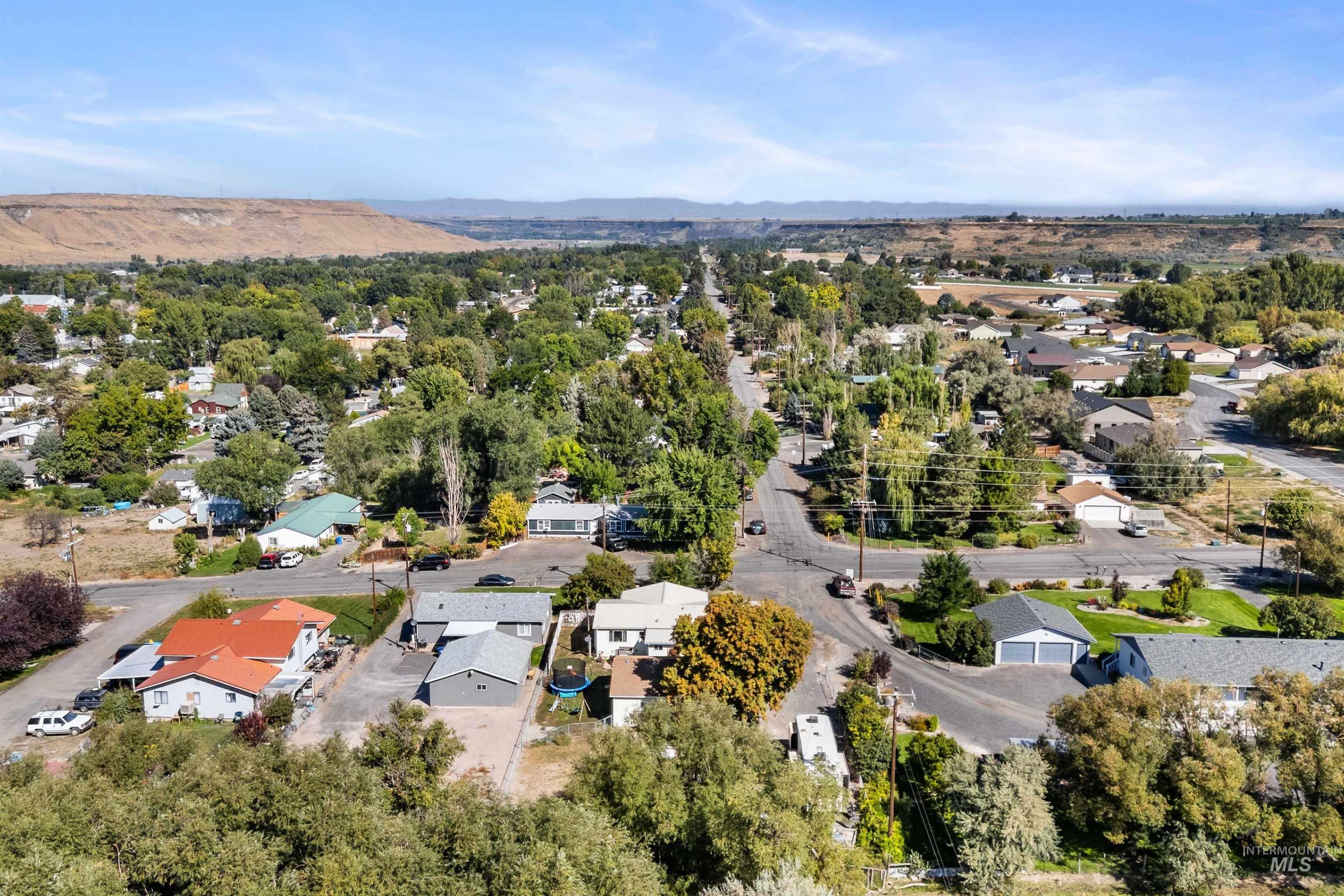 Aerial perspective of suburban area with a tree filled landscape