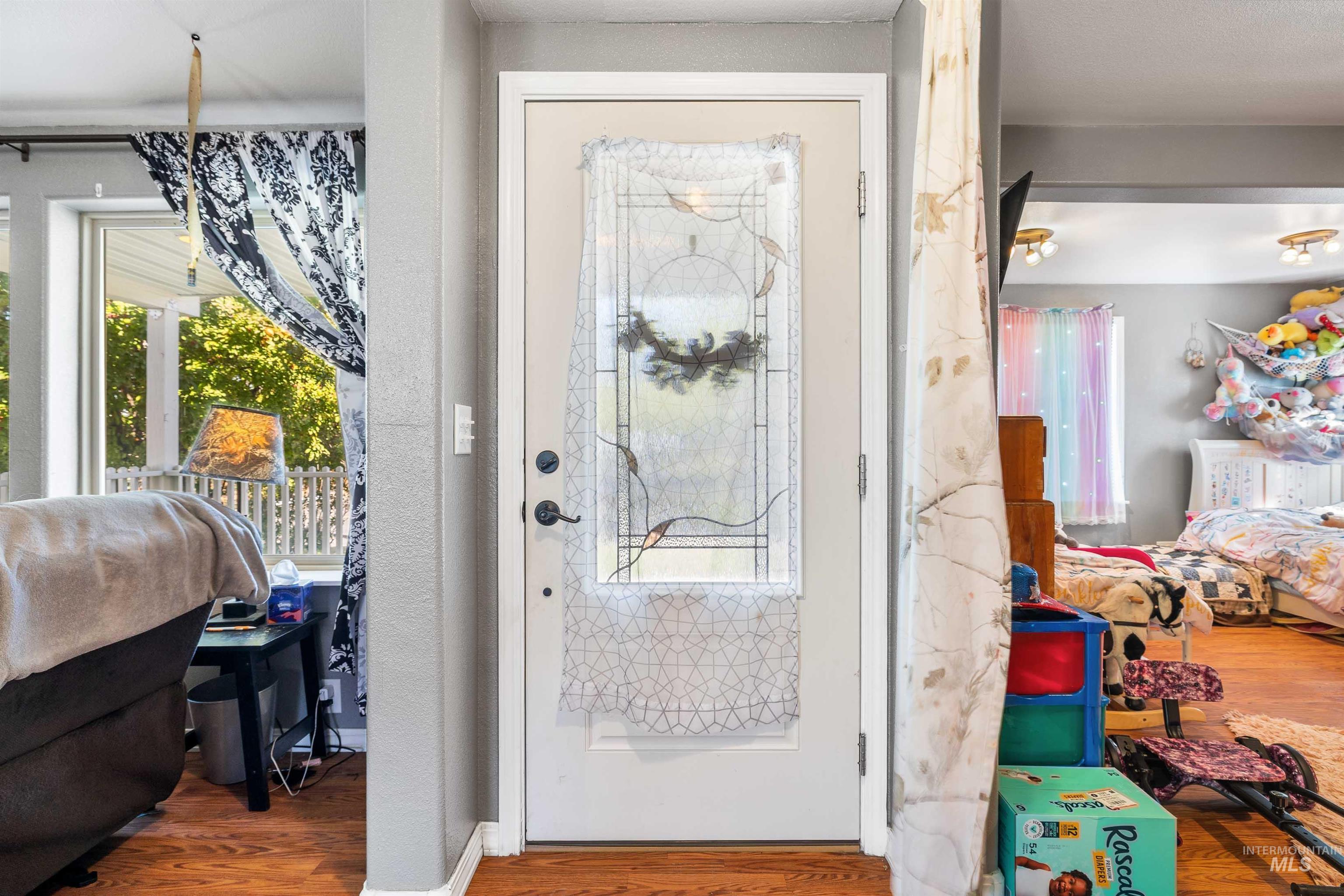 Doorway to outside with wood finished floors