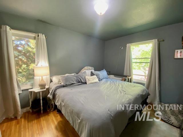 Bedroom with light wood-style floors