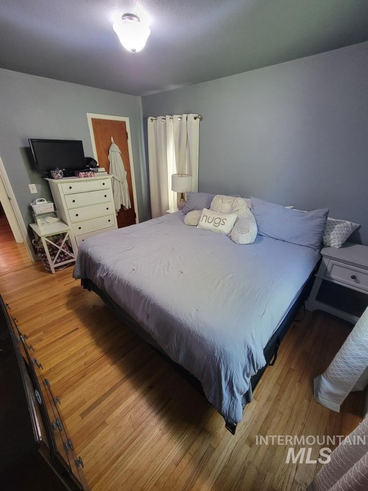Bedroom featuring wood finished floors