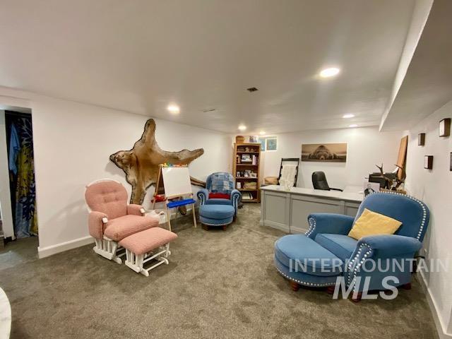 Living area featuring carpet and recessed lighting