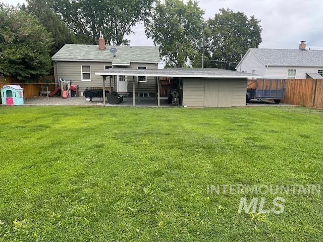 Back of property featuring a patio area and a chimney