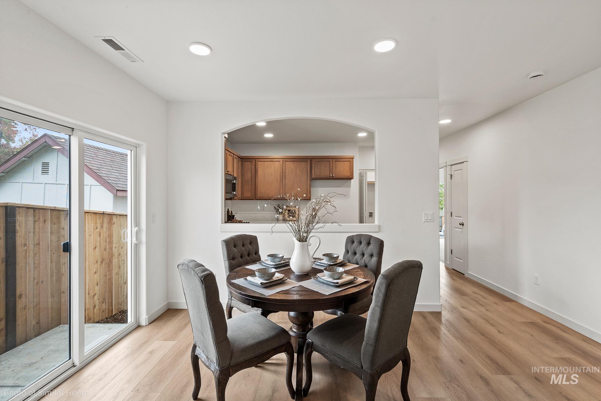 Dining space featuring plenty of natural light, recessed lighting, and light wood-style flooring