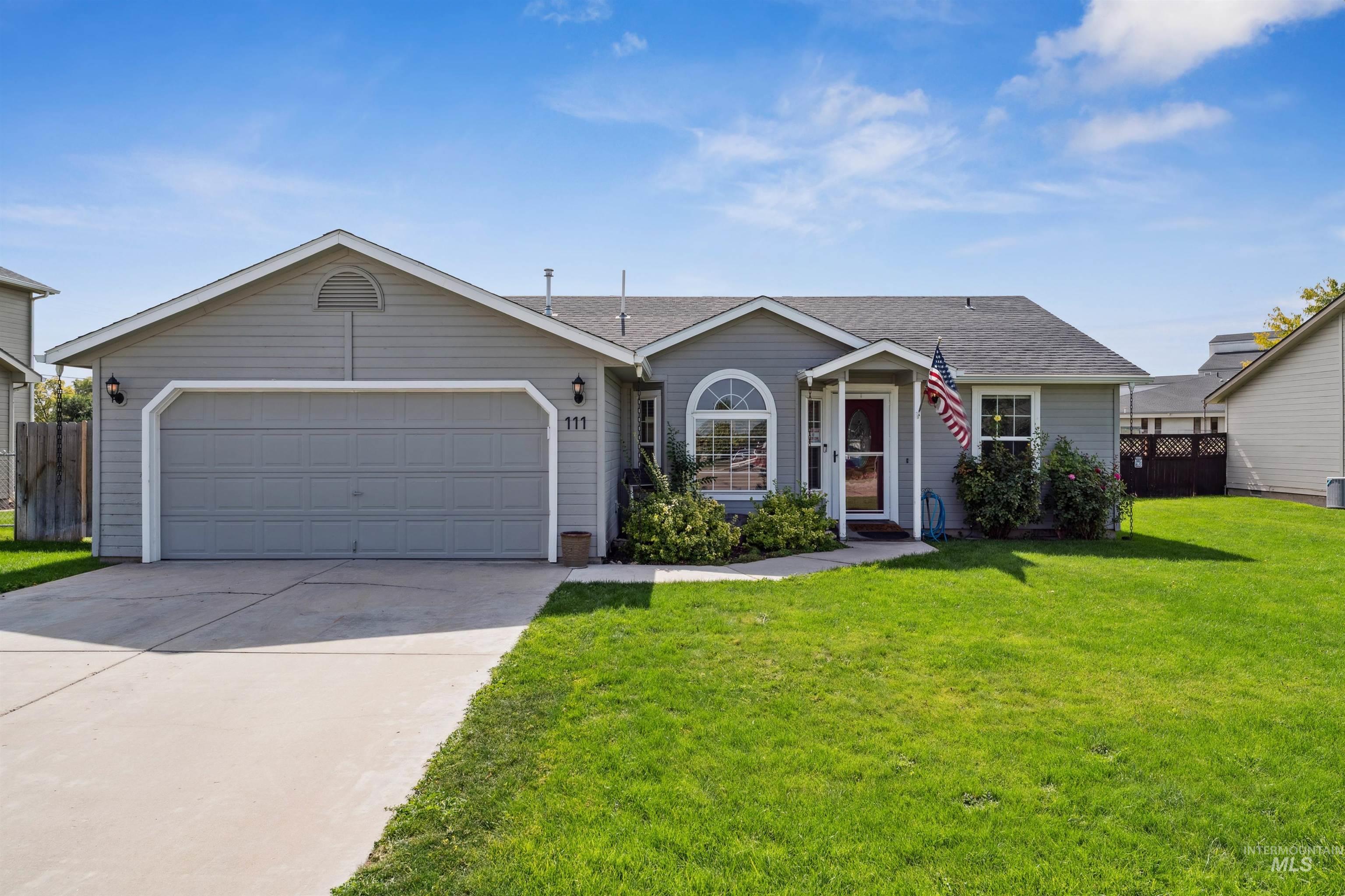 Single story home with roof with shingles, driveway, and a garage