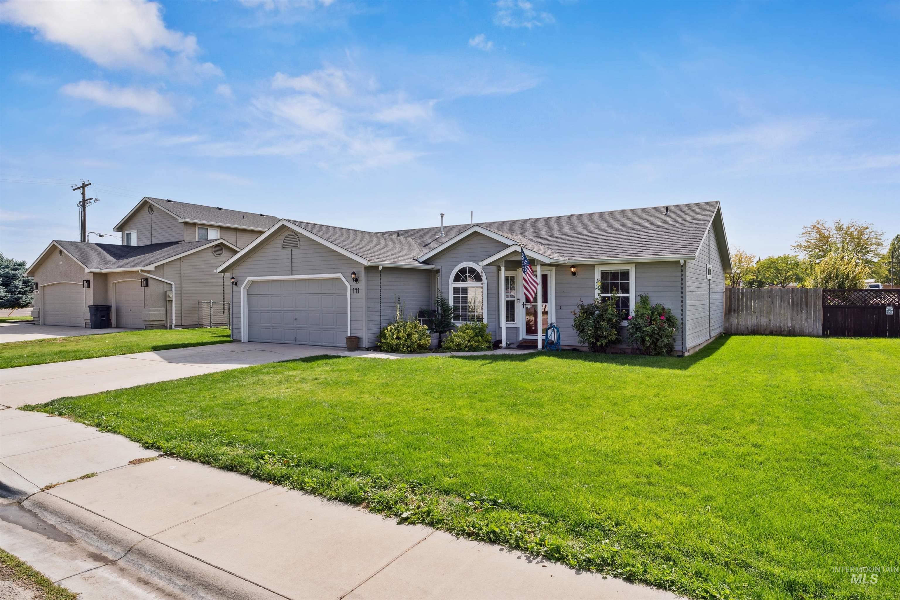View of front of home featuring concrete driveway, an attached garage, and a shingled roof