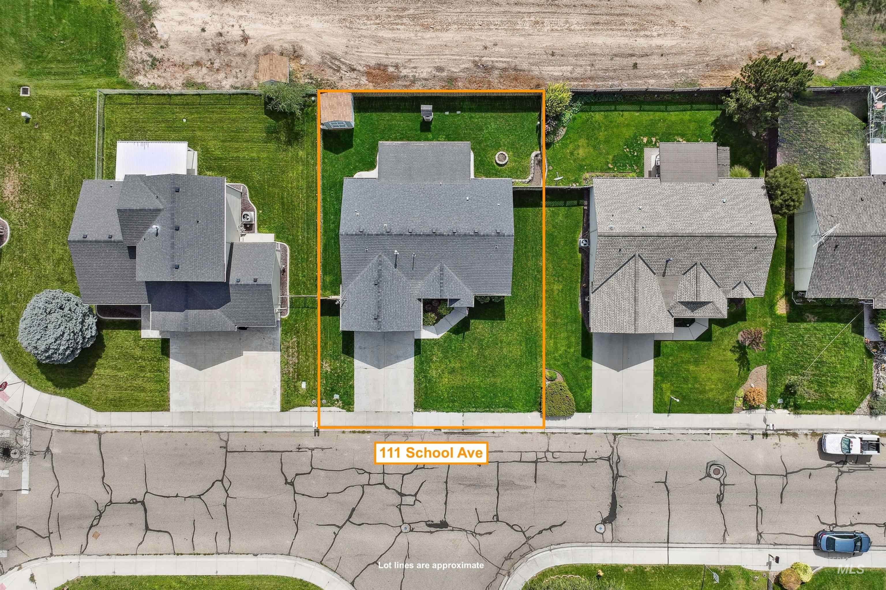 Aerial view of residential area with property parcel outlined