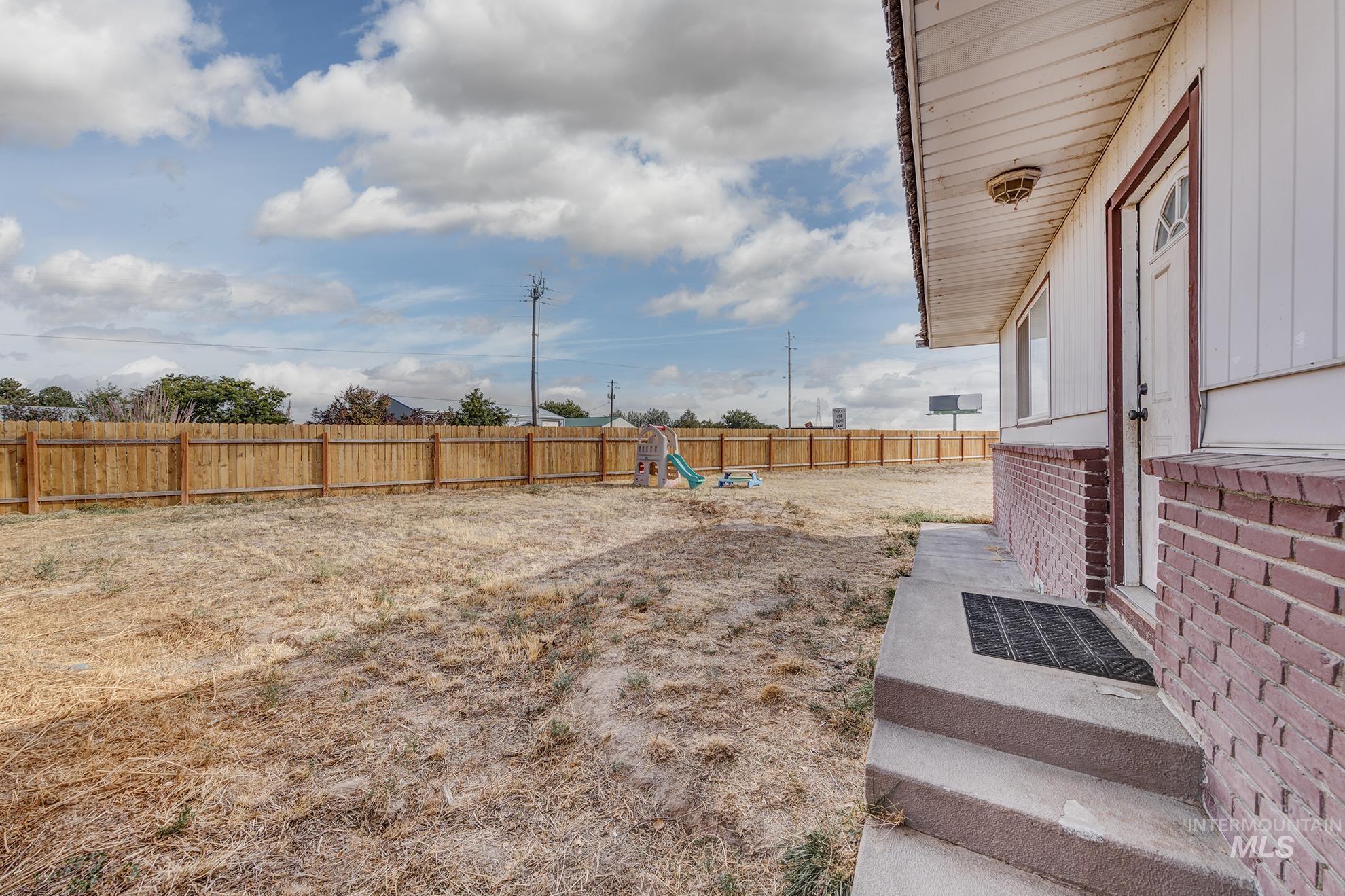 View of fenced backyard