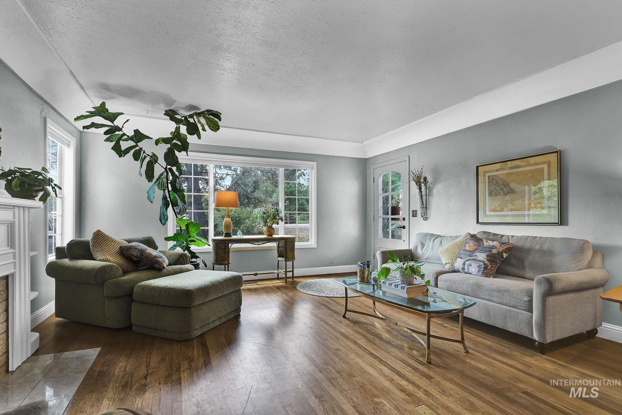 Living area featuring hard wood floors and a Coved ceiling