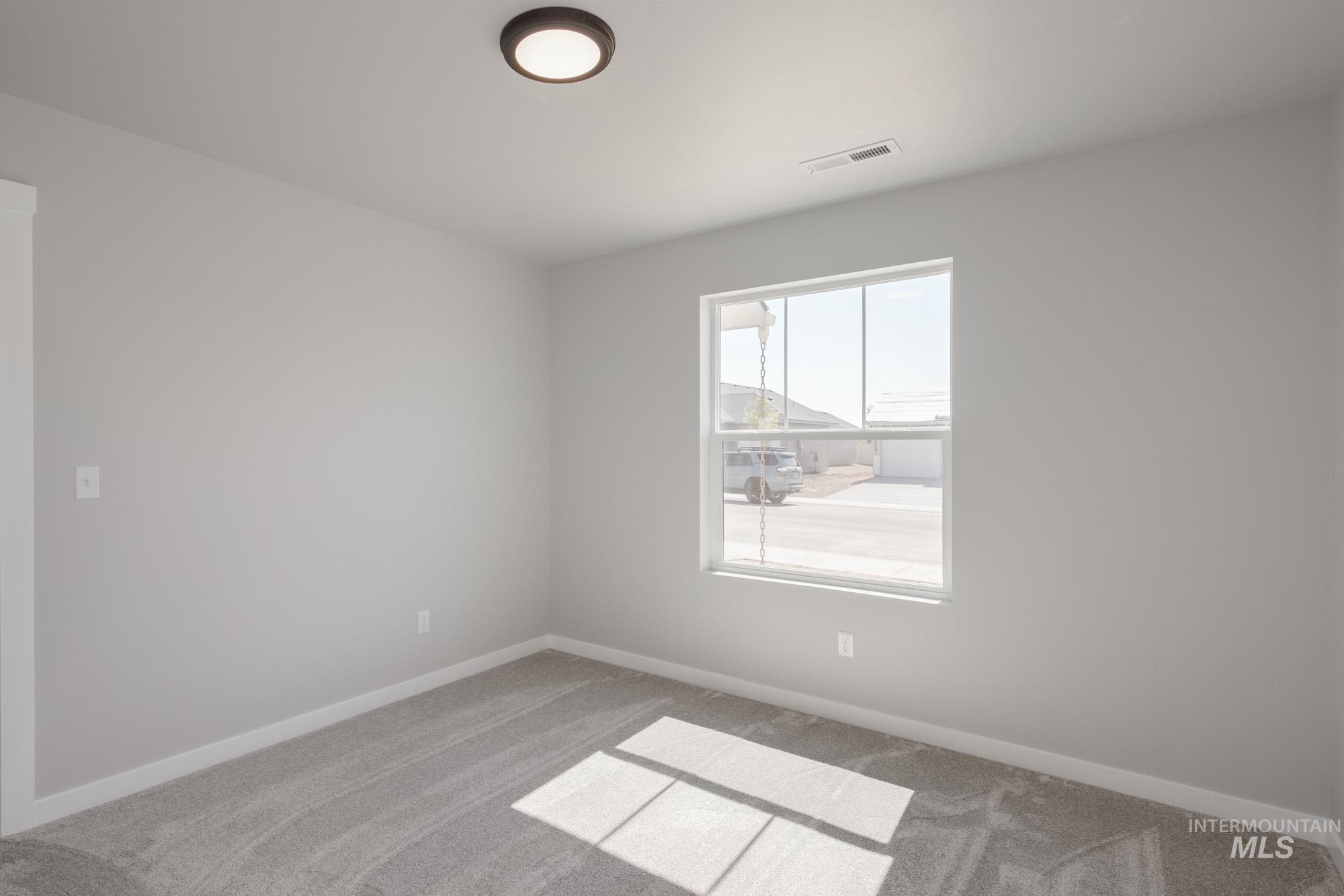 Empty room with carpet floors