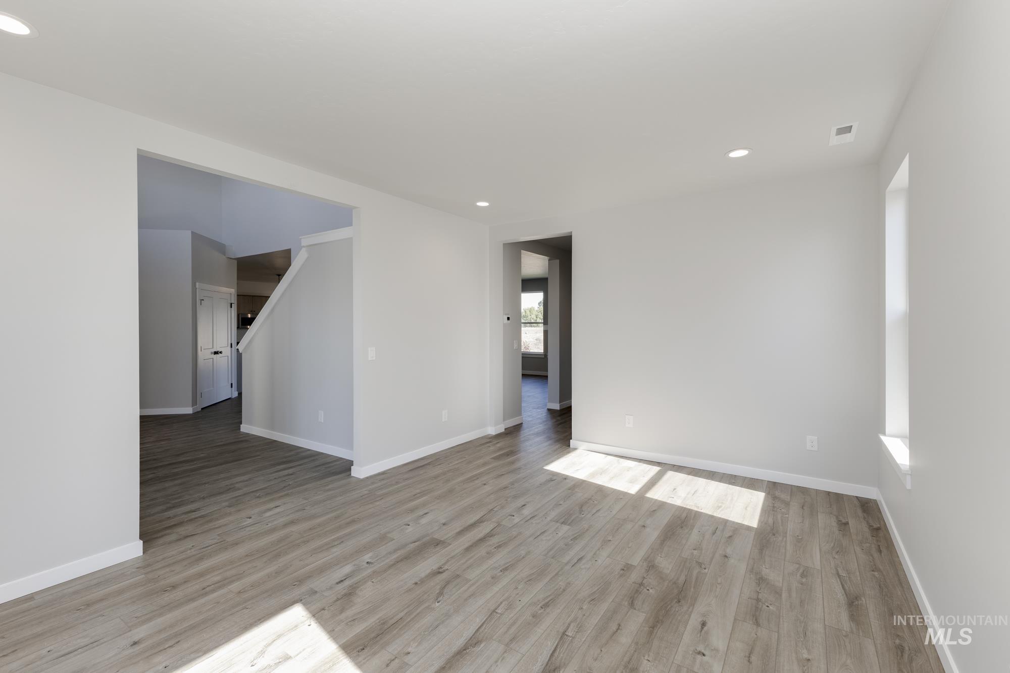 Spare room with recessed lighting and light wood-style floors