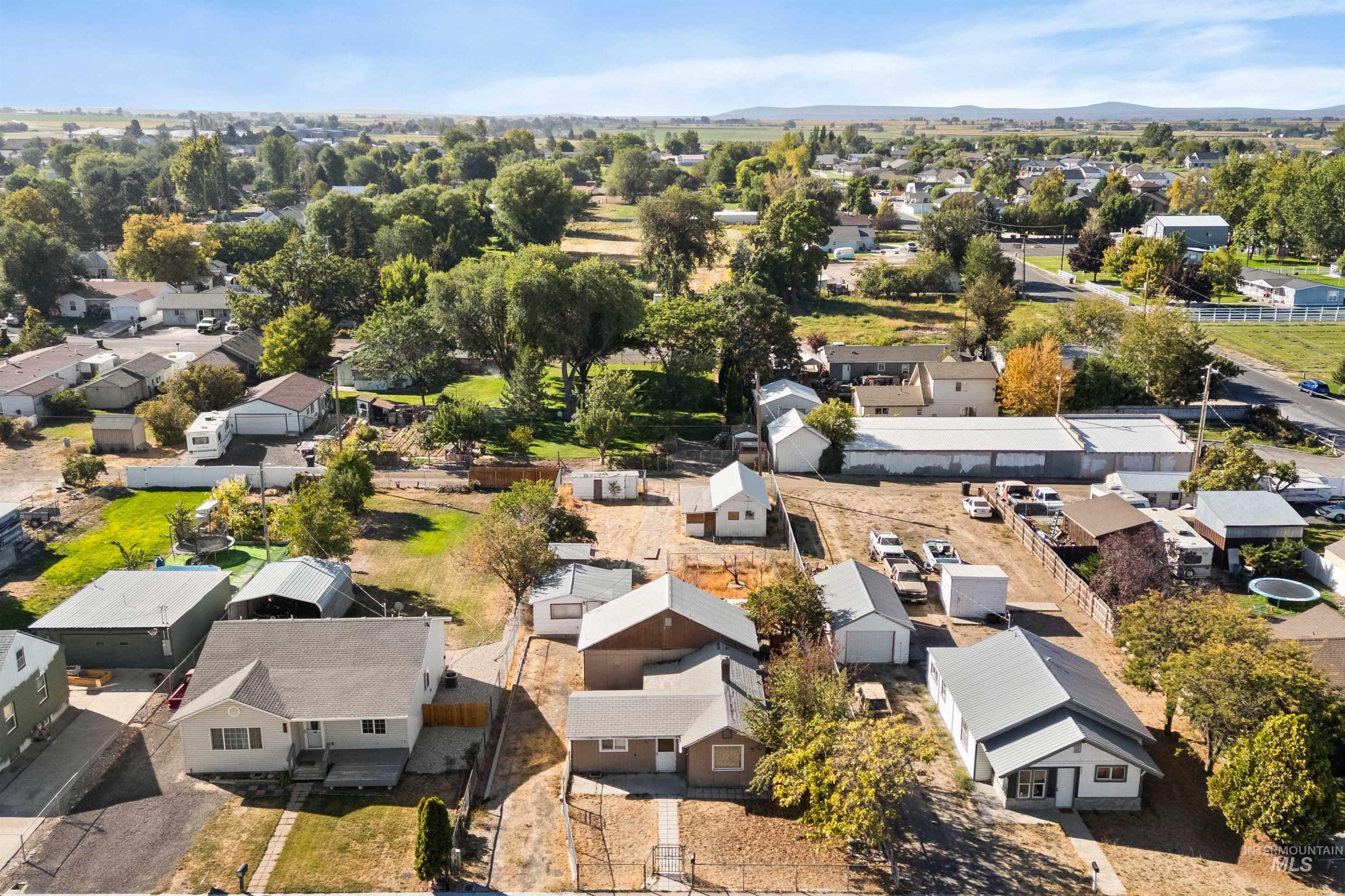 Aerial perspective of suburban area with a mountainous background