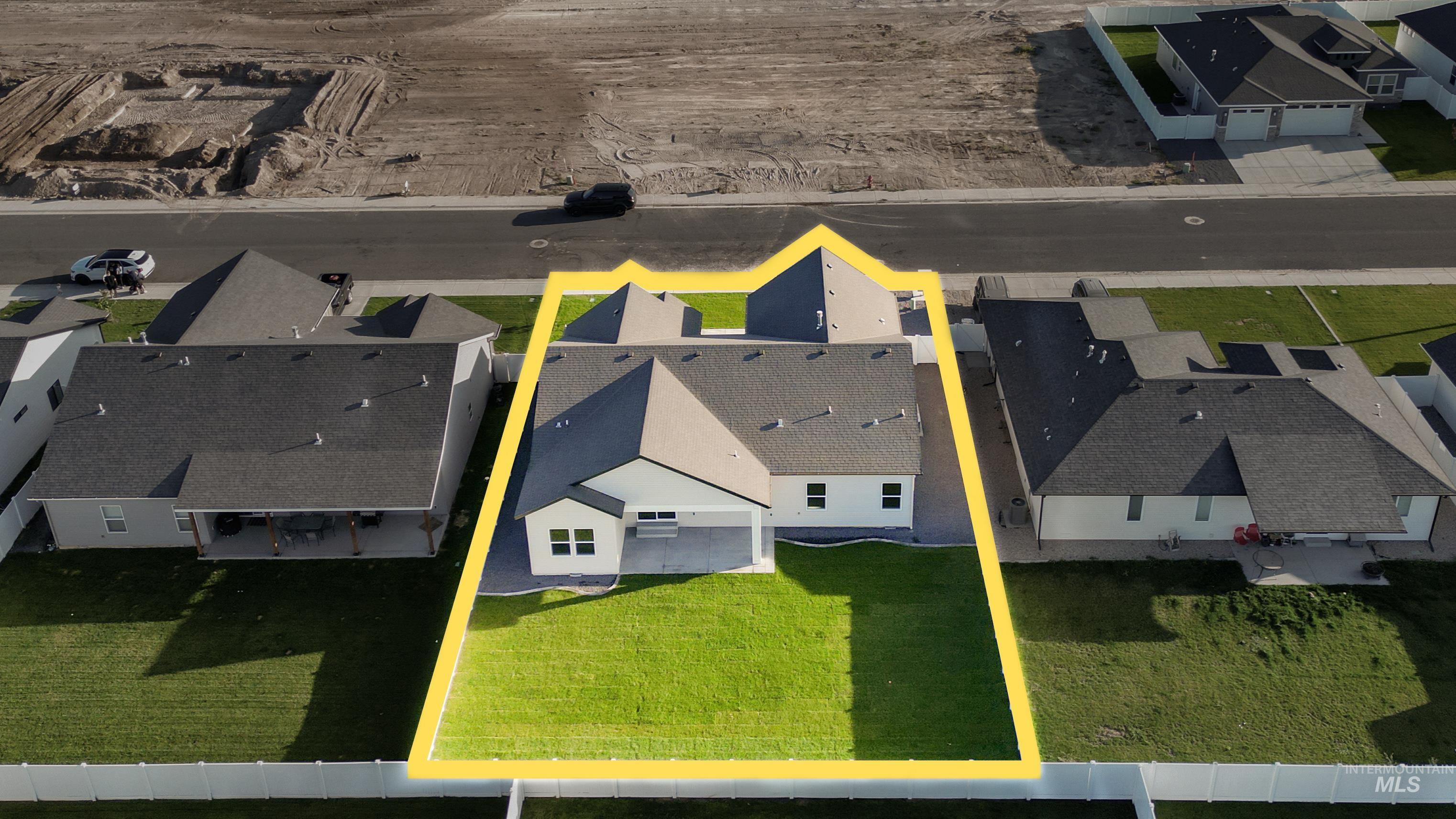 Aerial perspective of suburban area featuring property boundaries highlighted
