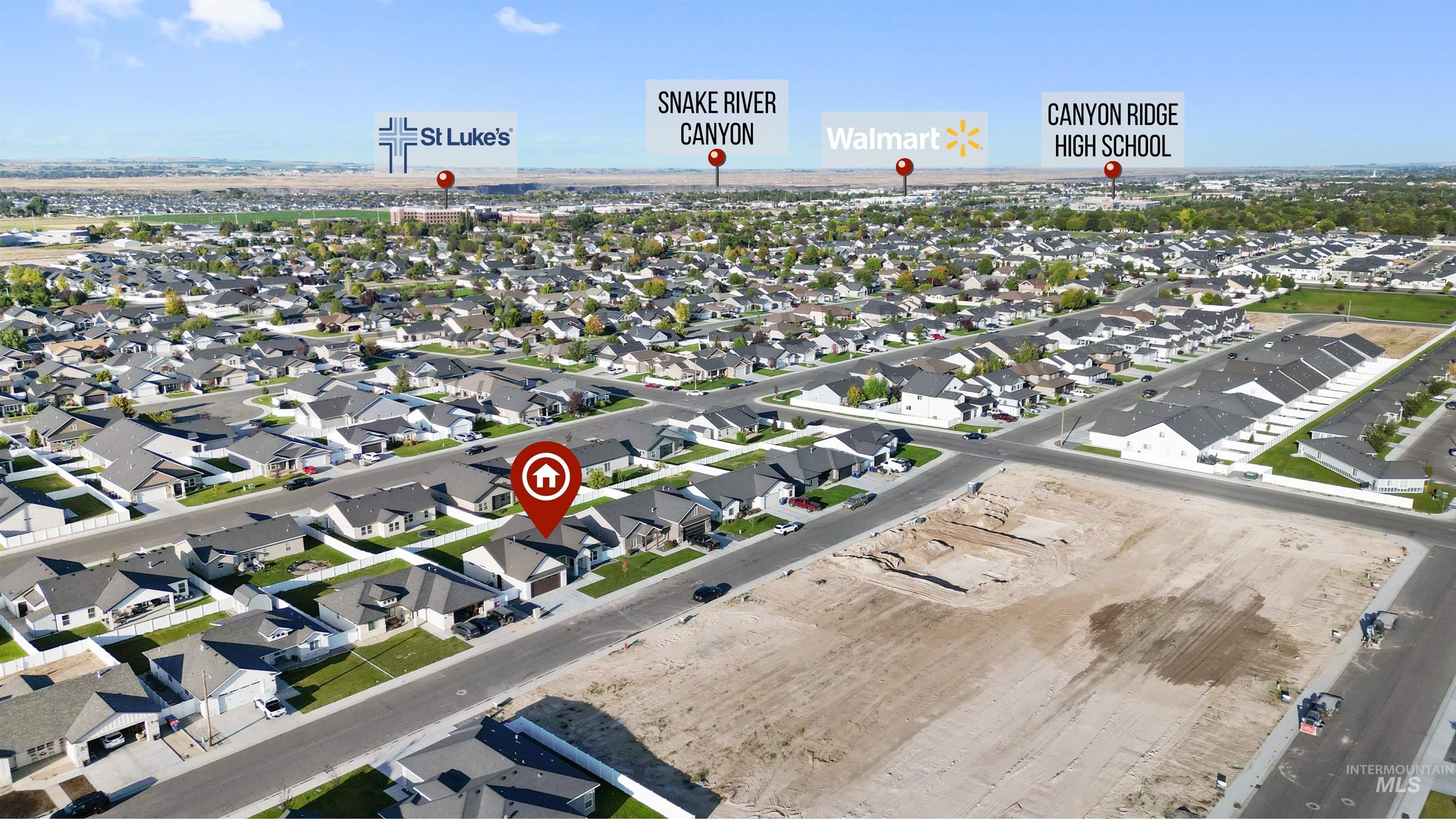 View of property location with nearby suburban area