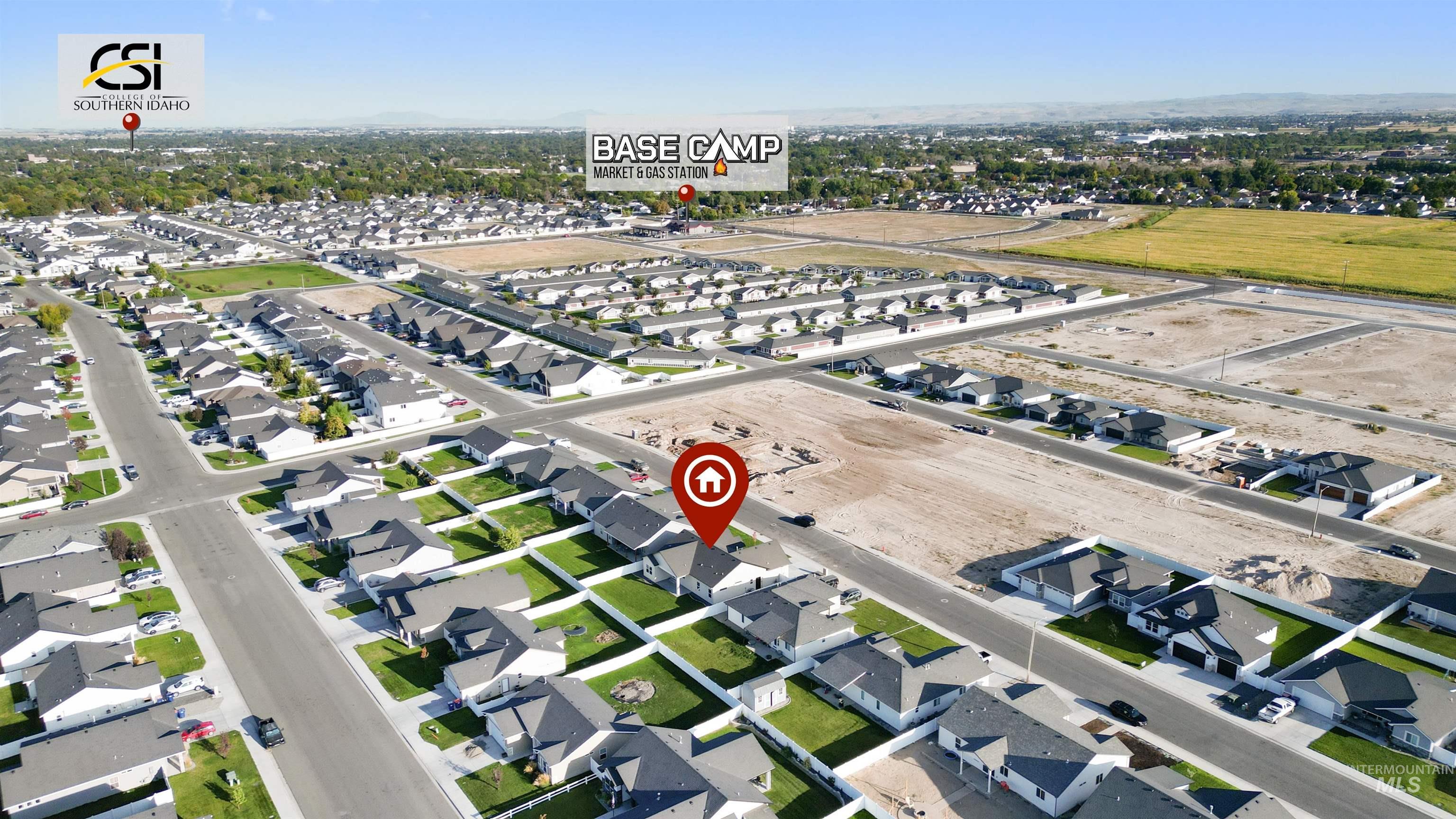 Aerial overview of property's location featuring nearby suburban area