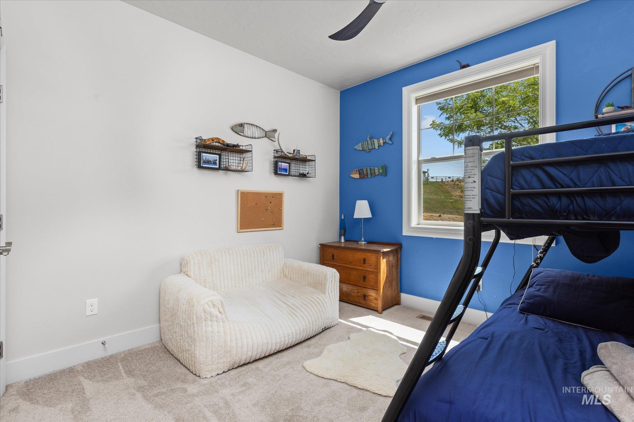 Bedroom with carpet floors and ceiling fan