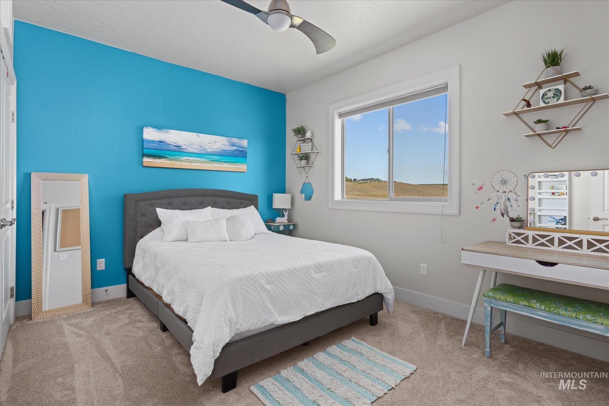 Bedroom featuring carpet floors and a ceiling fan