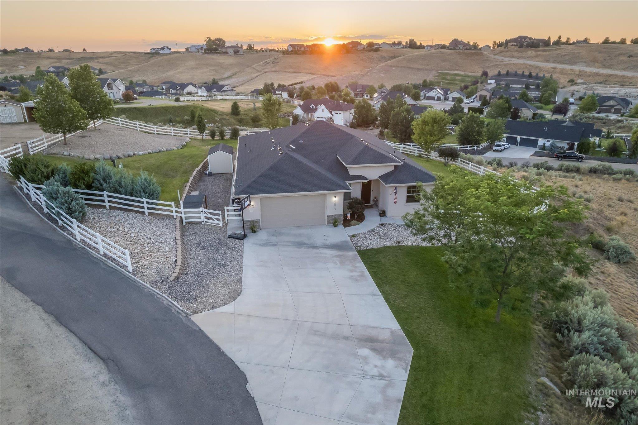Aerial view at dusk of a rural view and a residential view