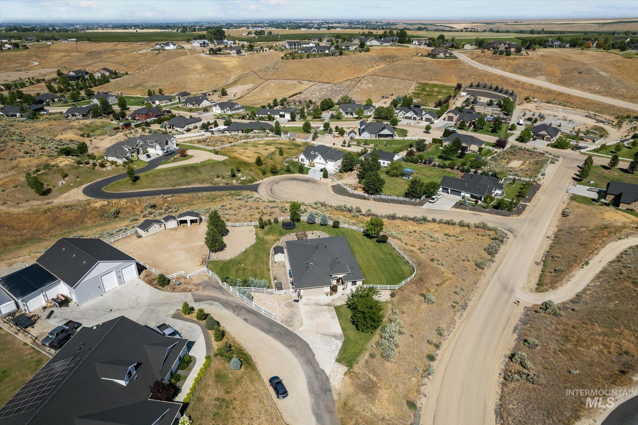 Aerial overview of property's location with nearby suburban area