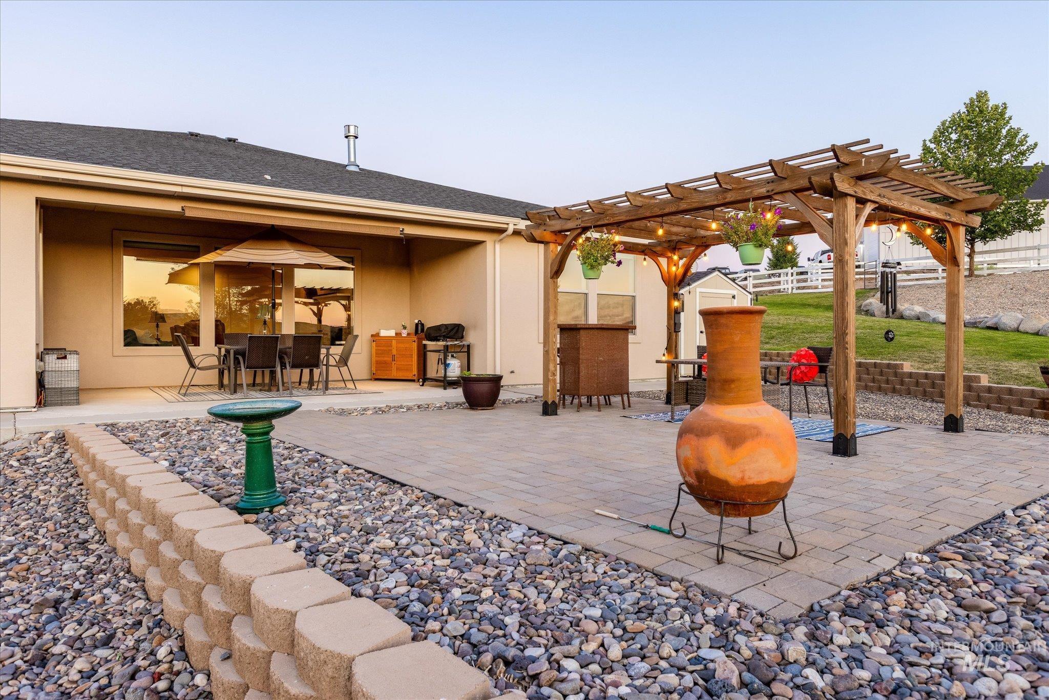 View of patio / terrace with a pergola and outdoor dining area