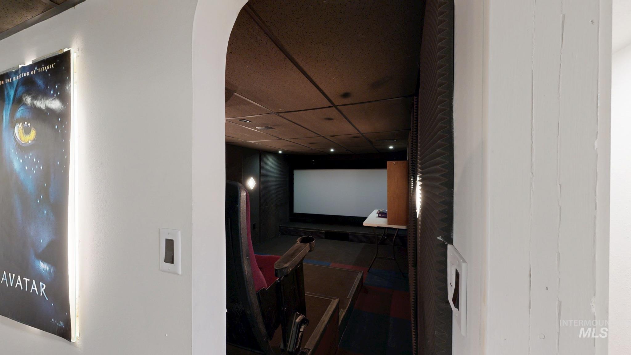 Home theater featuring a paneled ceiling and recessed lighting