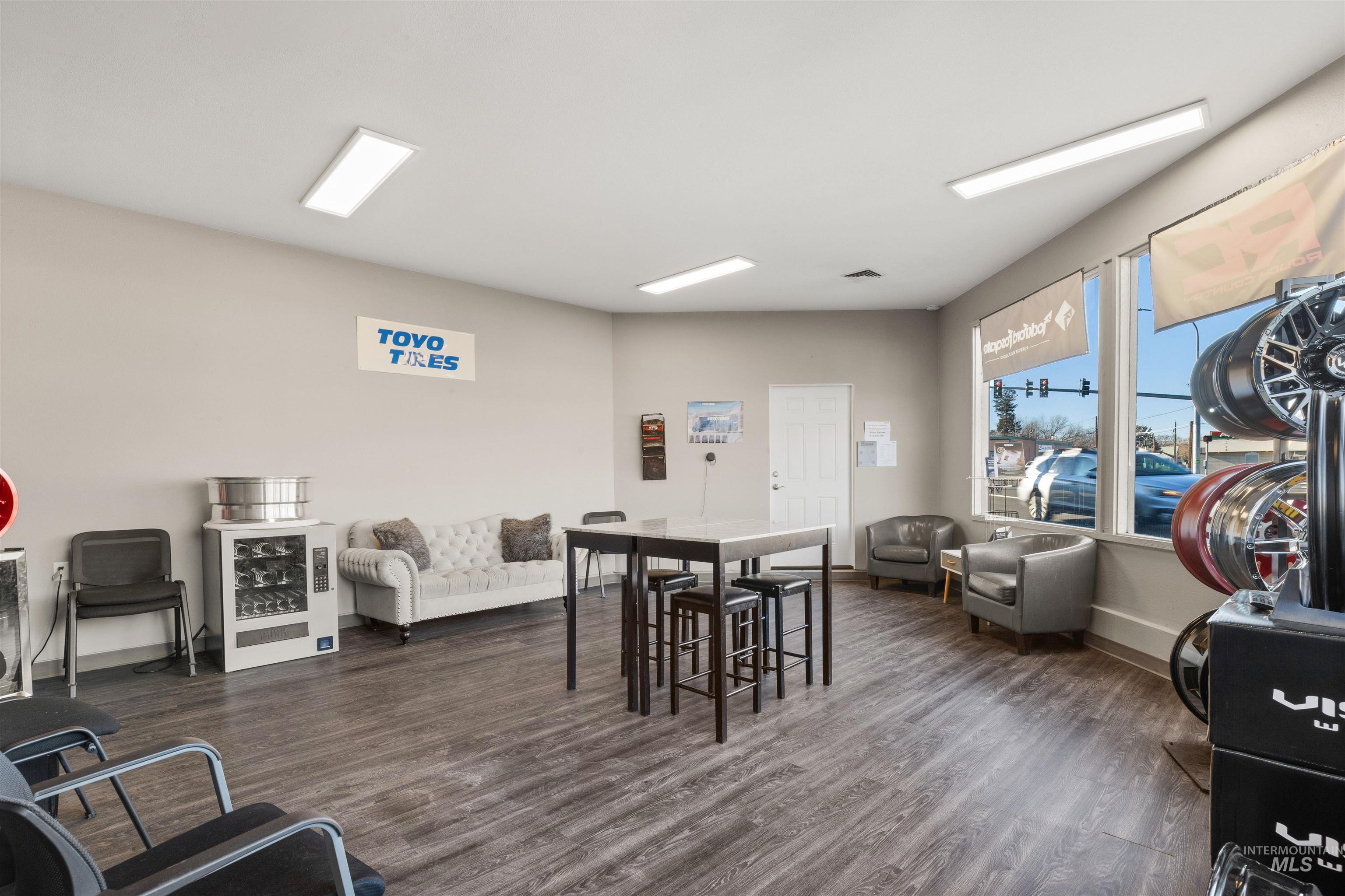 Dining space featuring dark wood-style floors