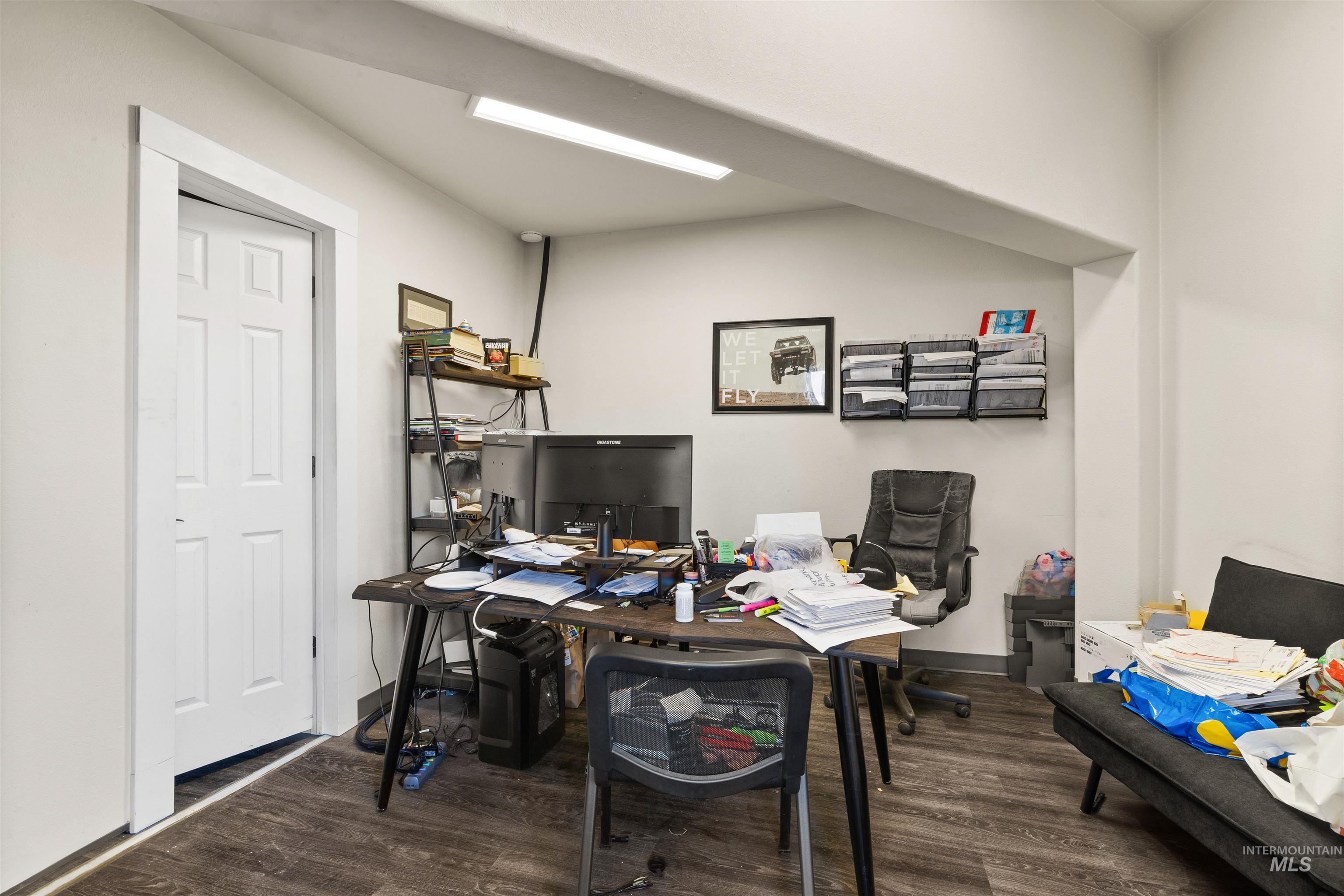 Office area featuring dark wood finished floors