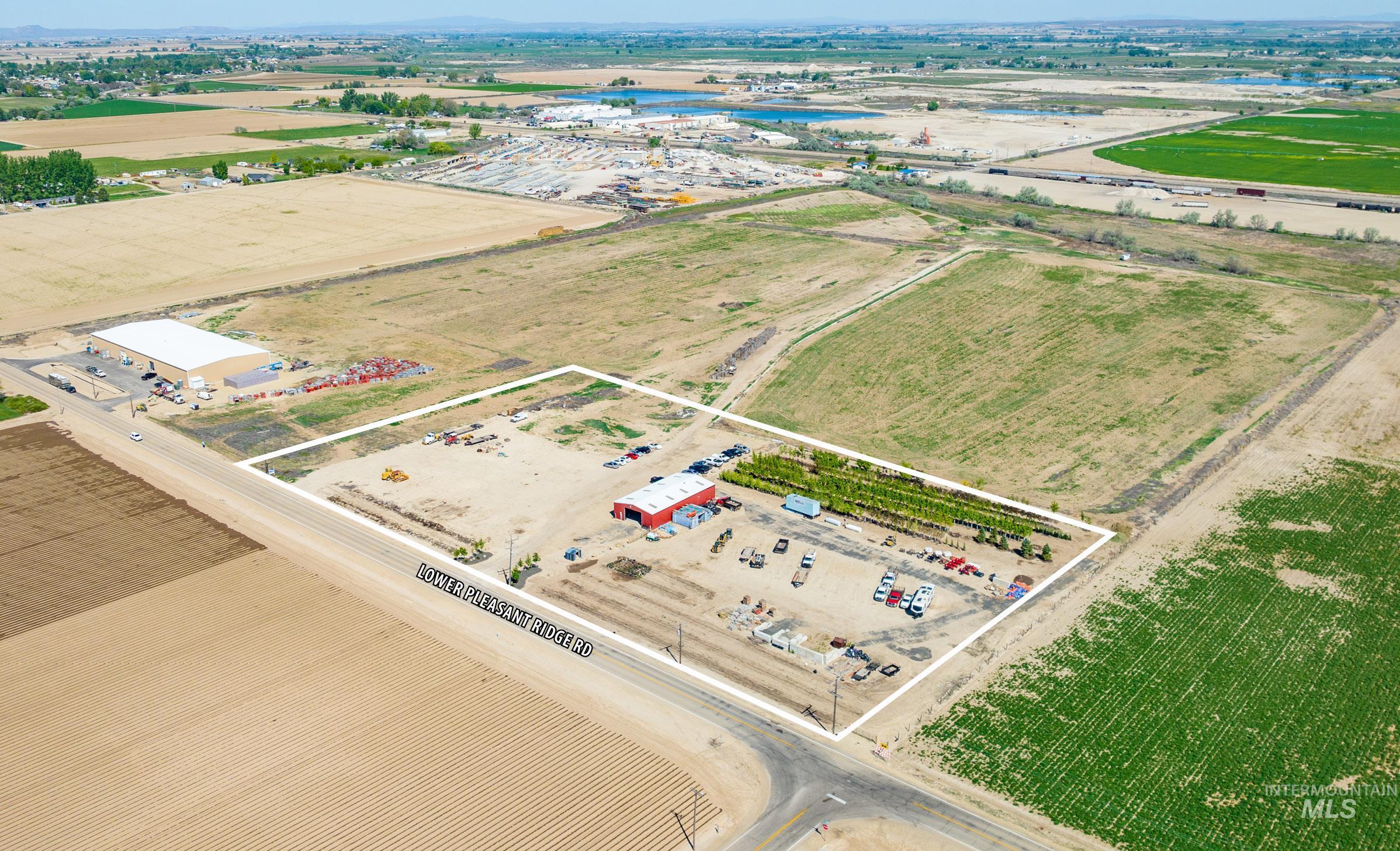 View of property location with property boundaries highlighted and an industrial area