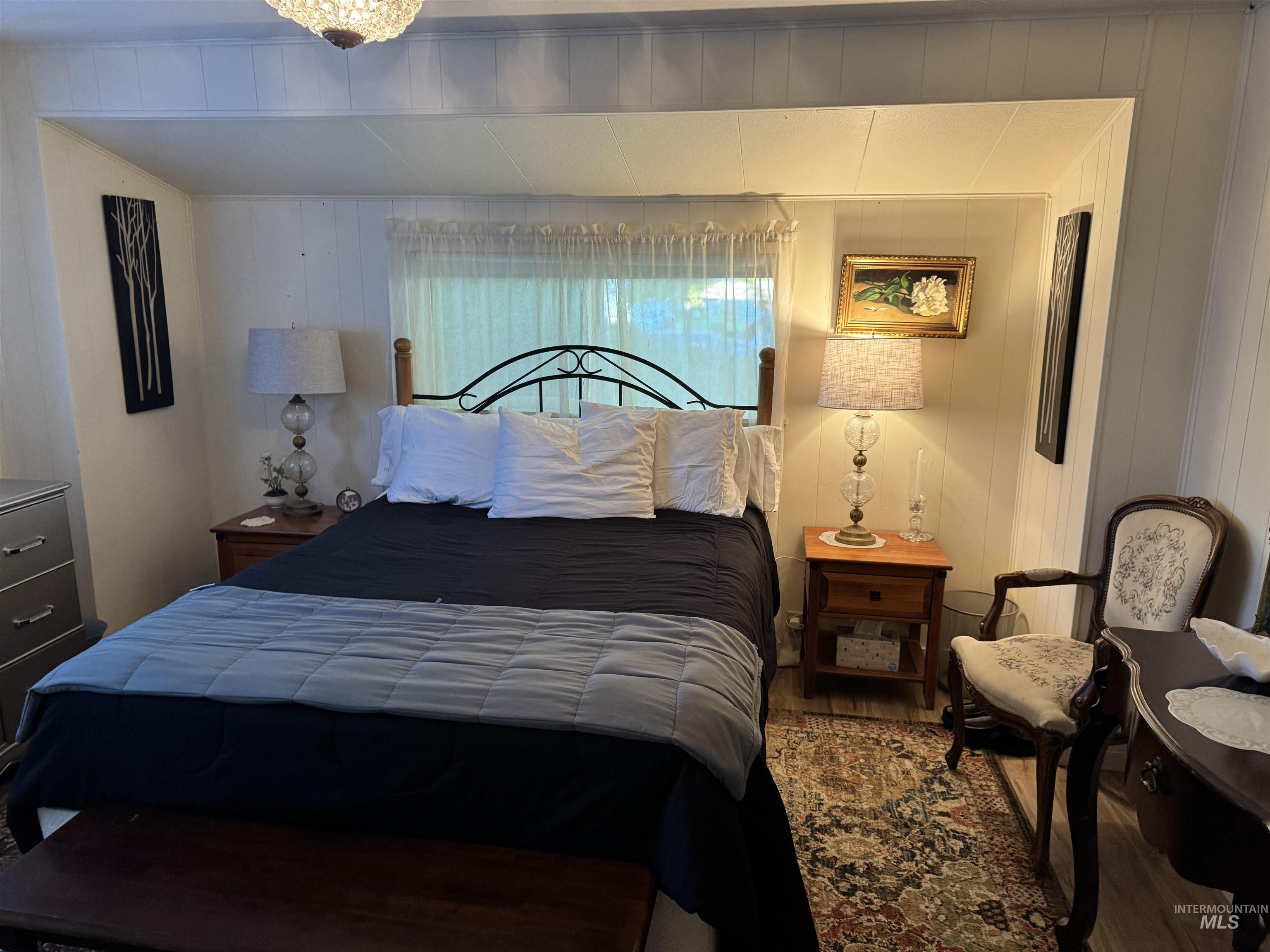 Bedroom with wood finished floors