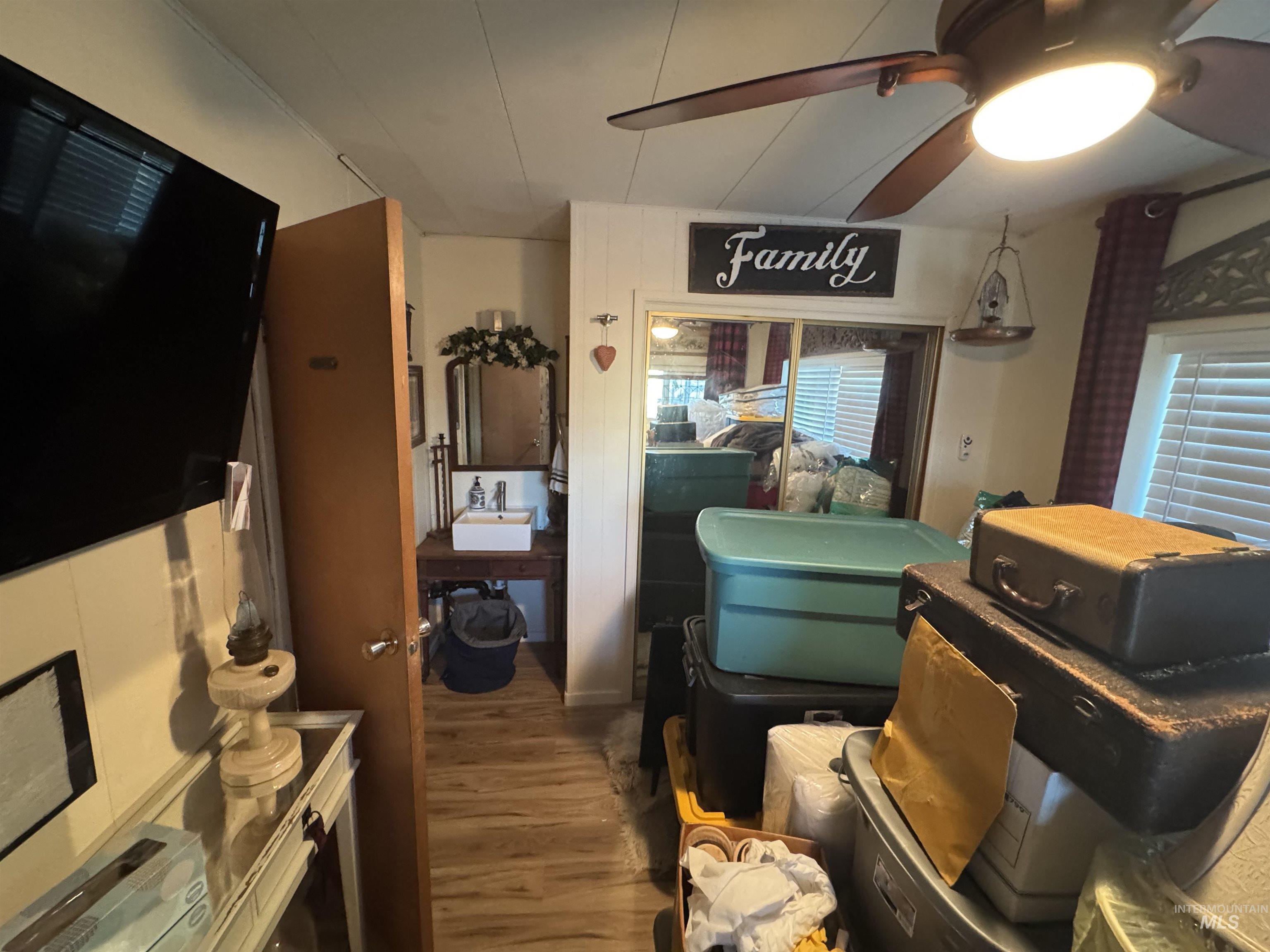 Interior space featuring wood finished floors and a ceiling fan