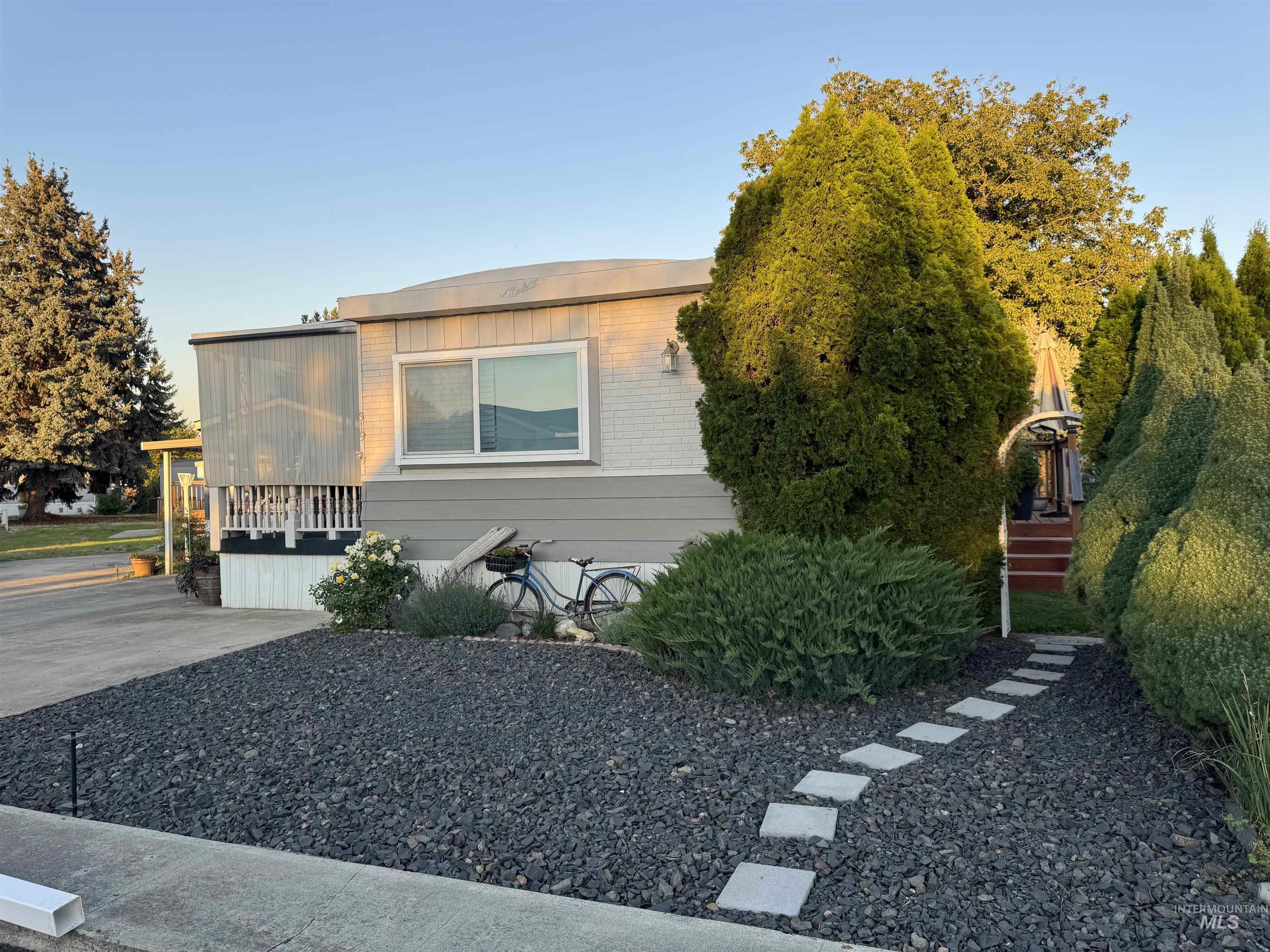 View of property exterior featuring brick siding