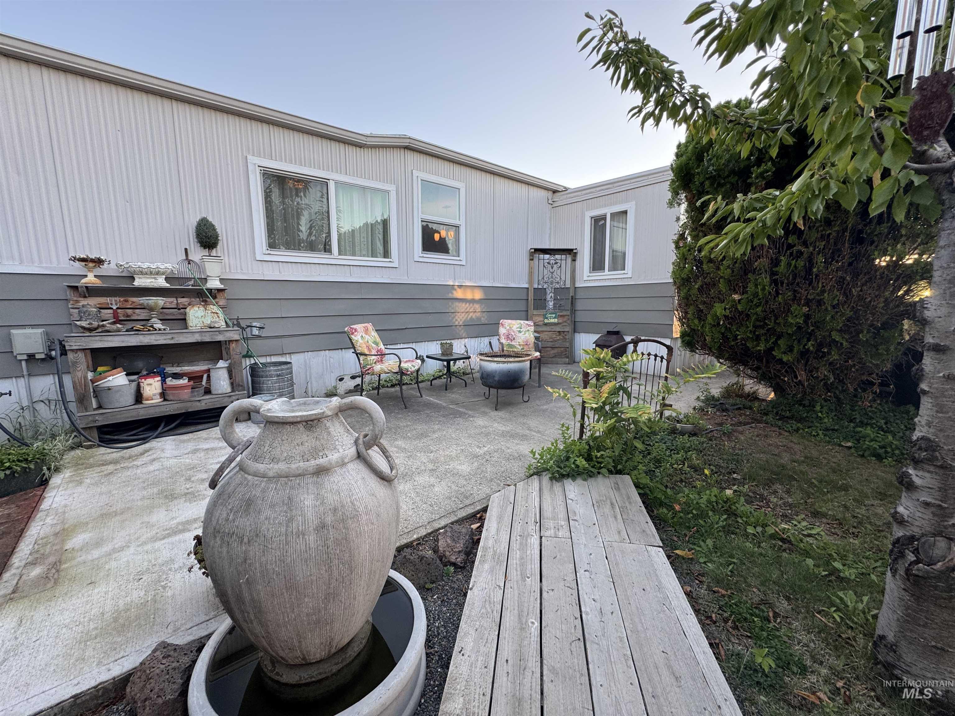 Back of house with a patio area