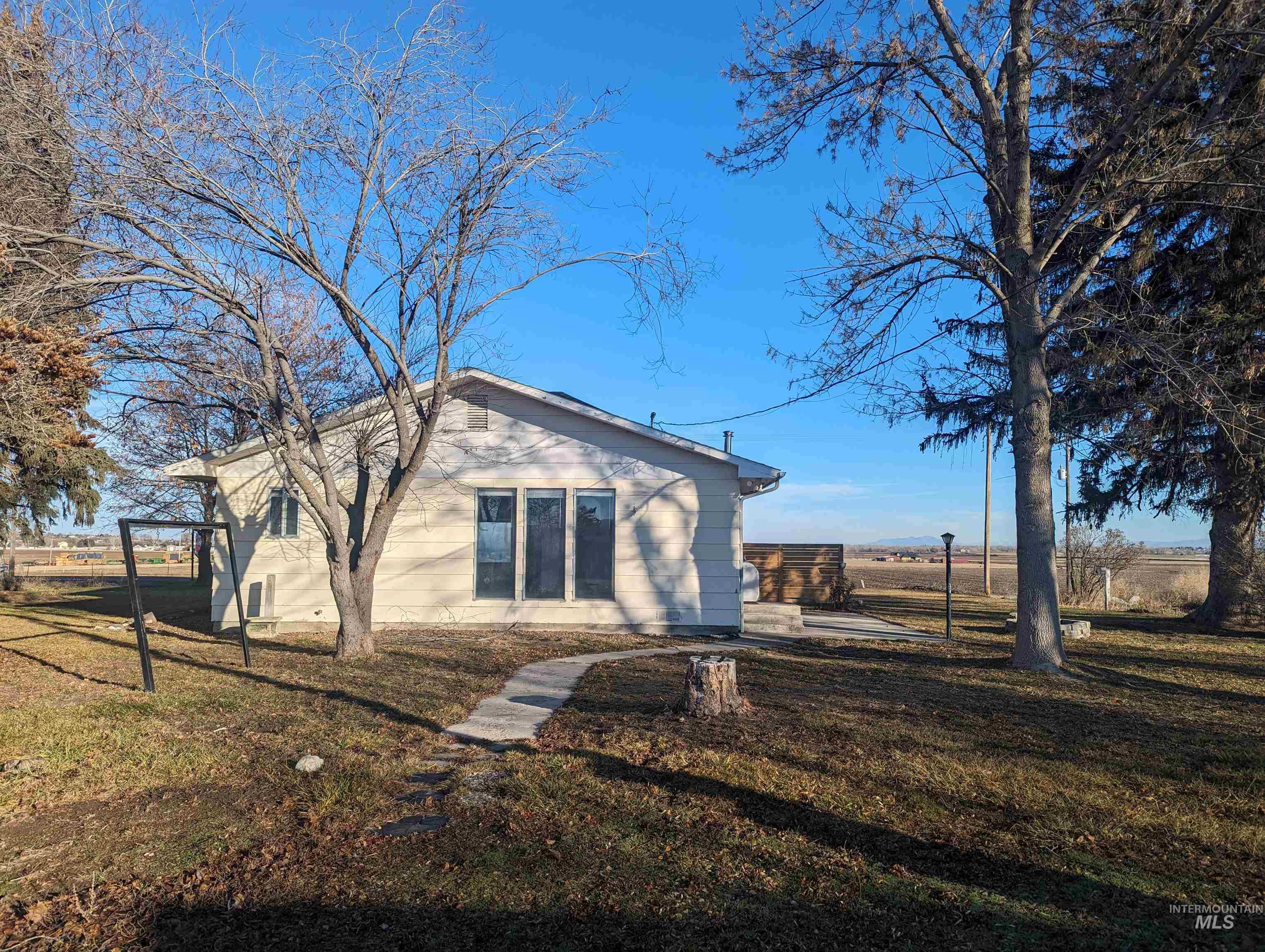 Back of house featuring a yard