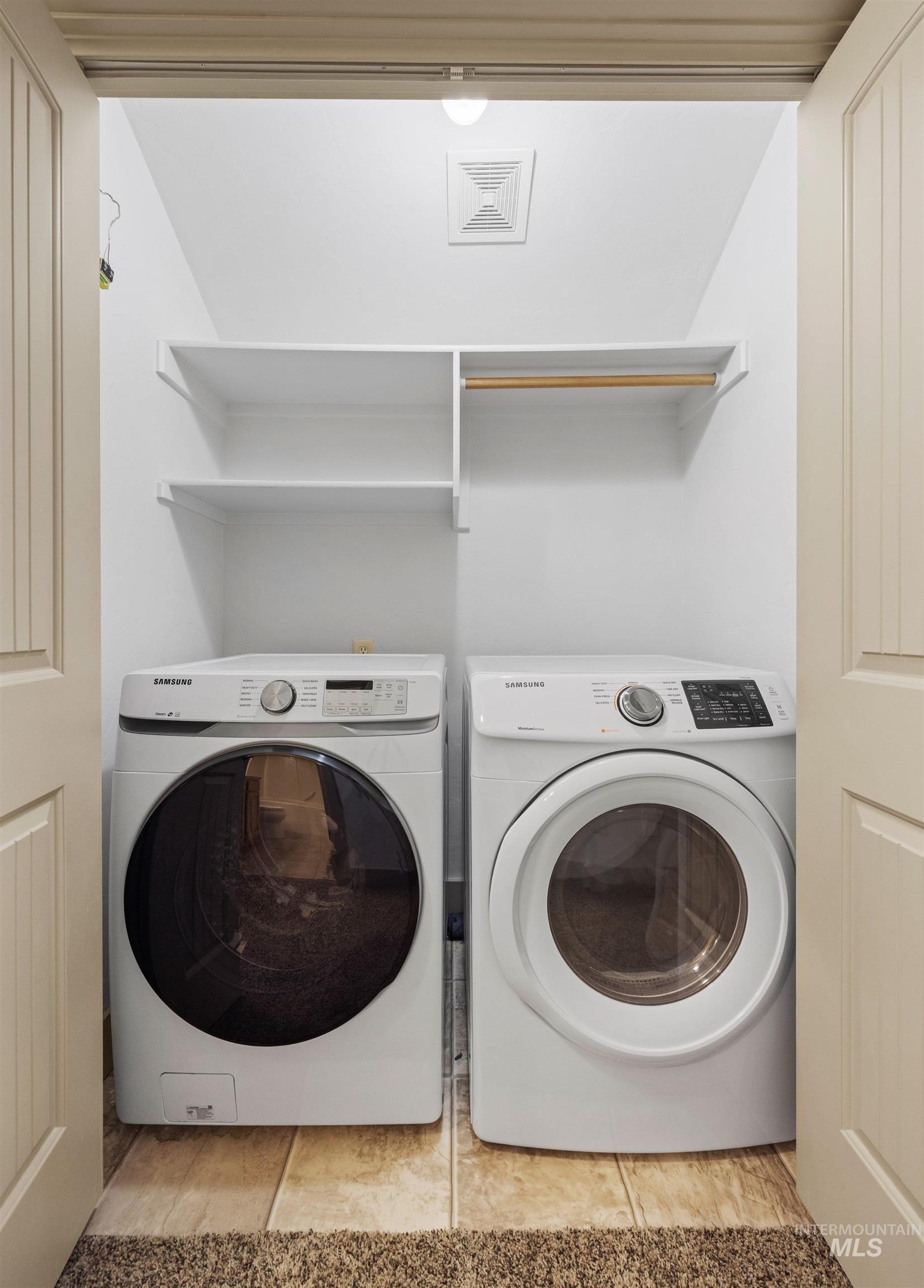 Laundry area featuring independent washer and dryer