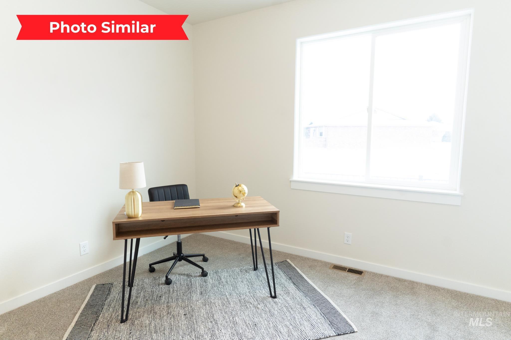 Office with light carpet and baseboards