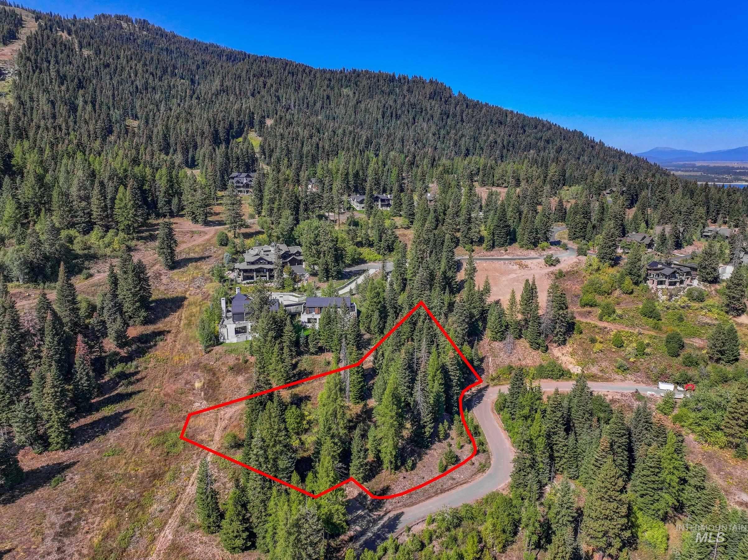 Aerial overview of property's location featuring property parcel outlined and ski mountain