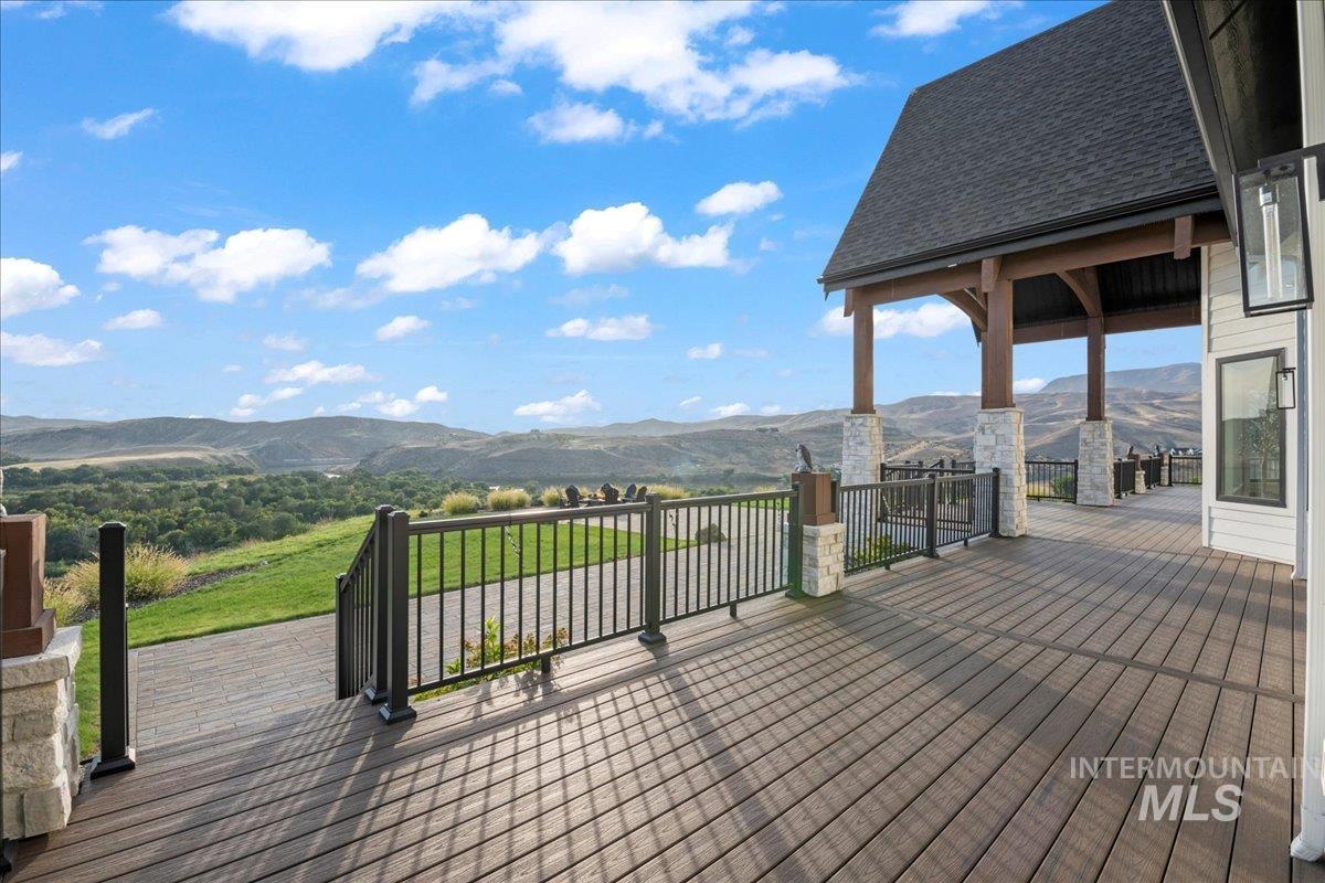 Wooden deck featuring a mountain view