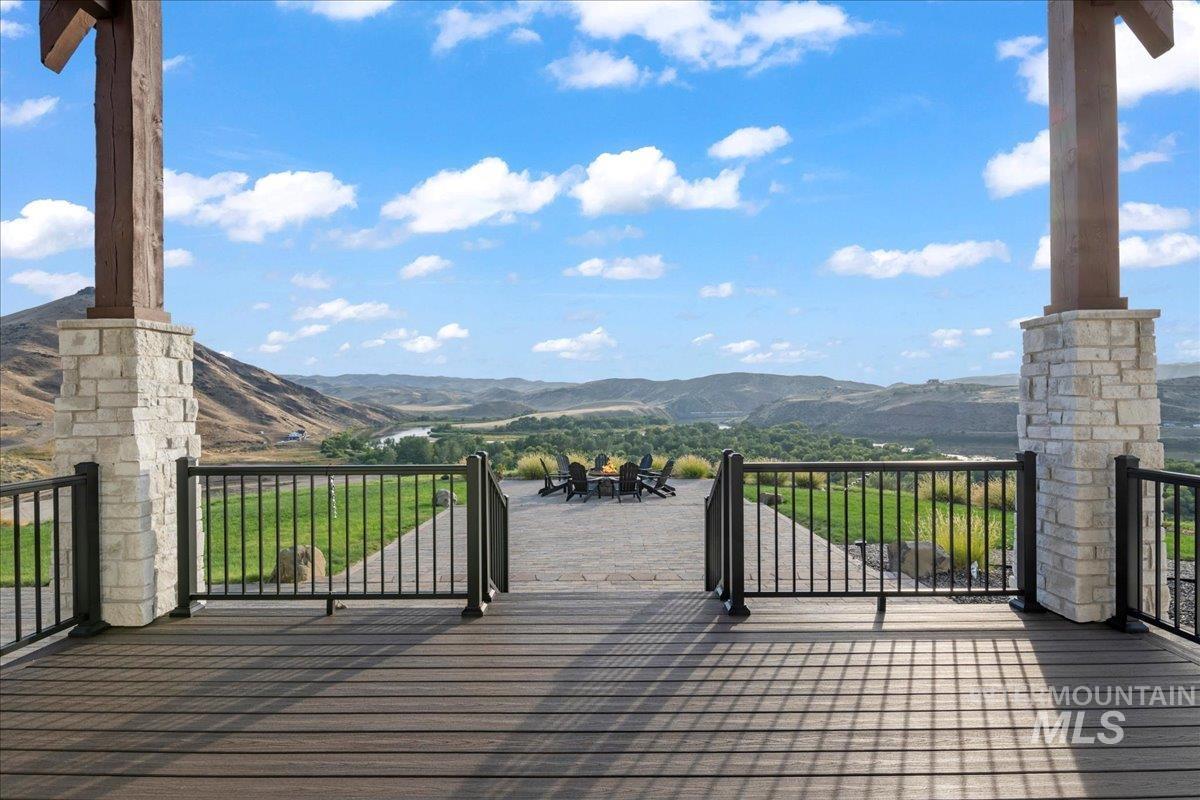 Wooden terrace featuring a mountain view