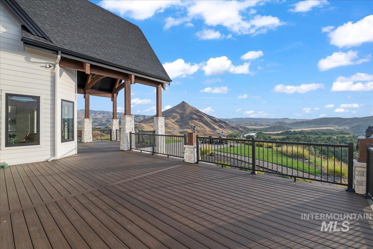 Wooden deck featuring a mountain view