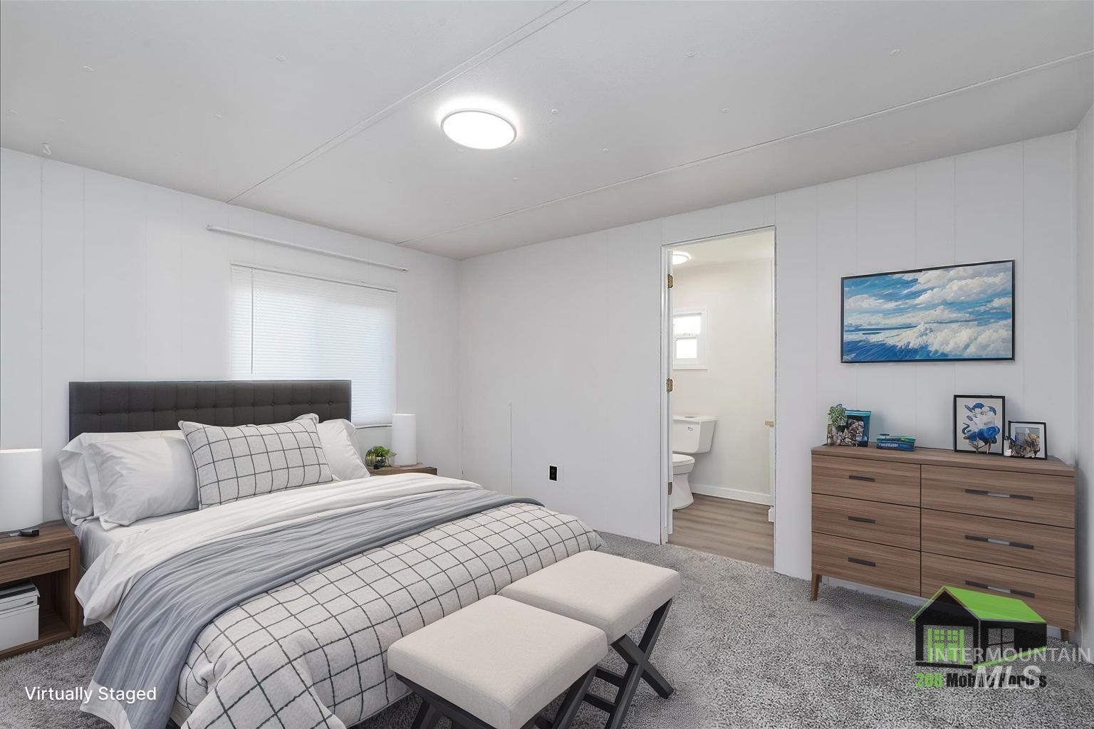 Bedroom with carpet flooring and connected bathroom
