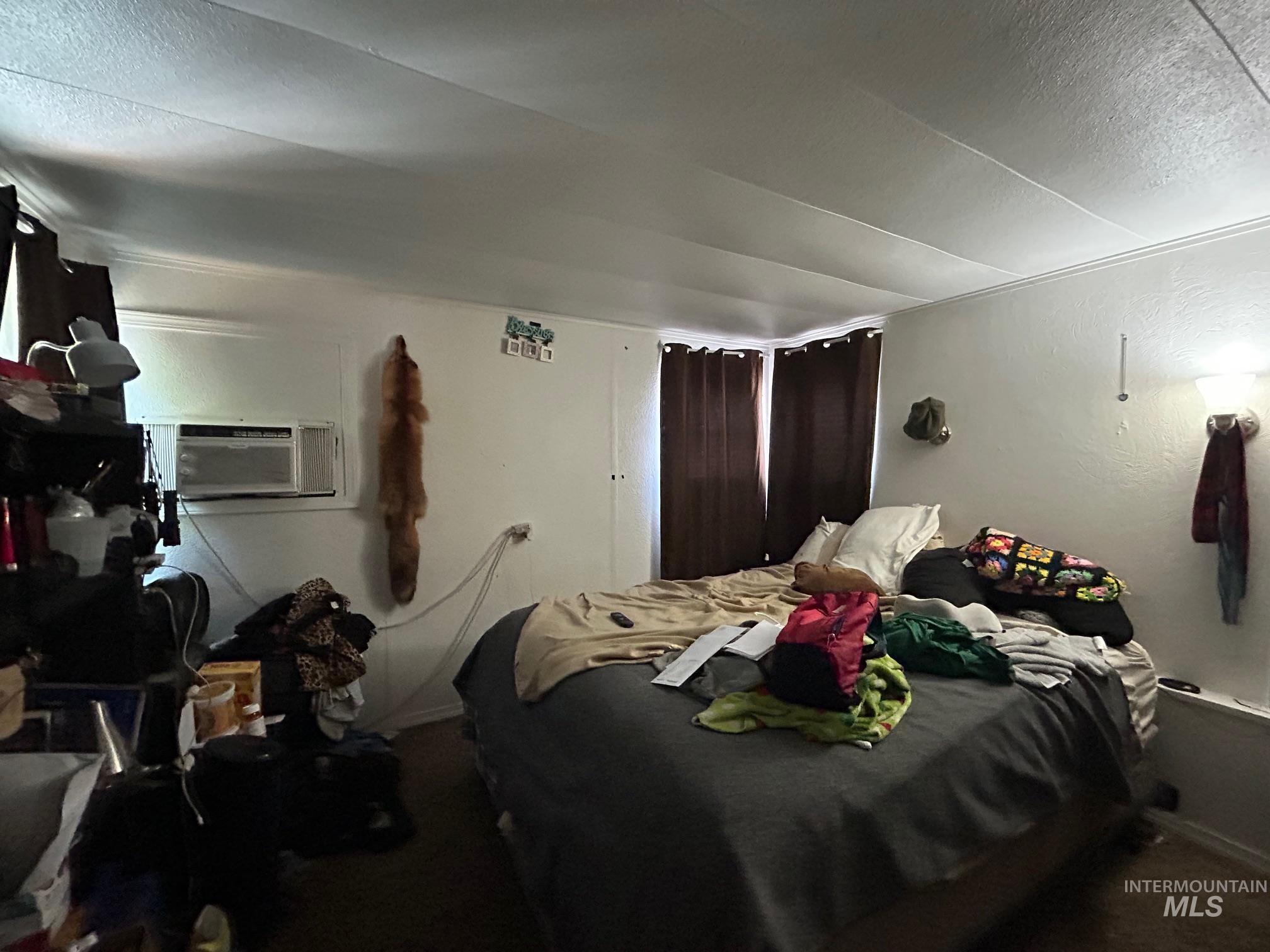 Bedroom featuring a textured ceiling