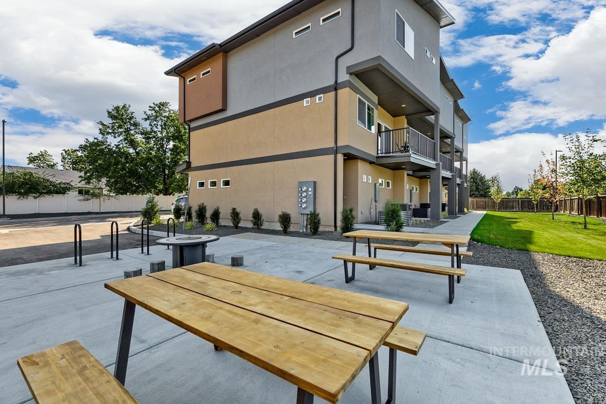 View of property's community with a patio area and a balcony