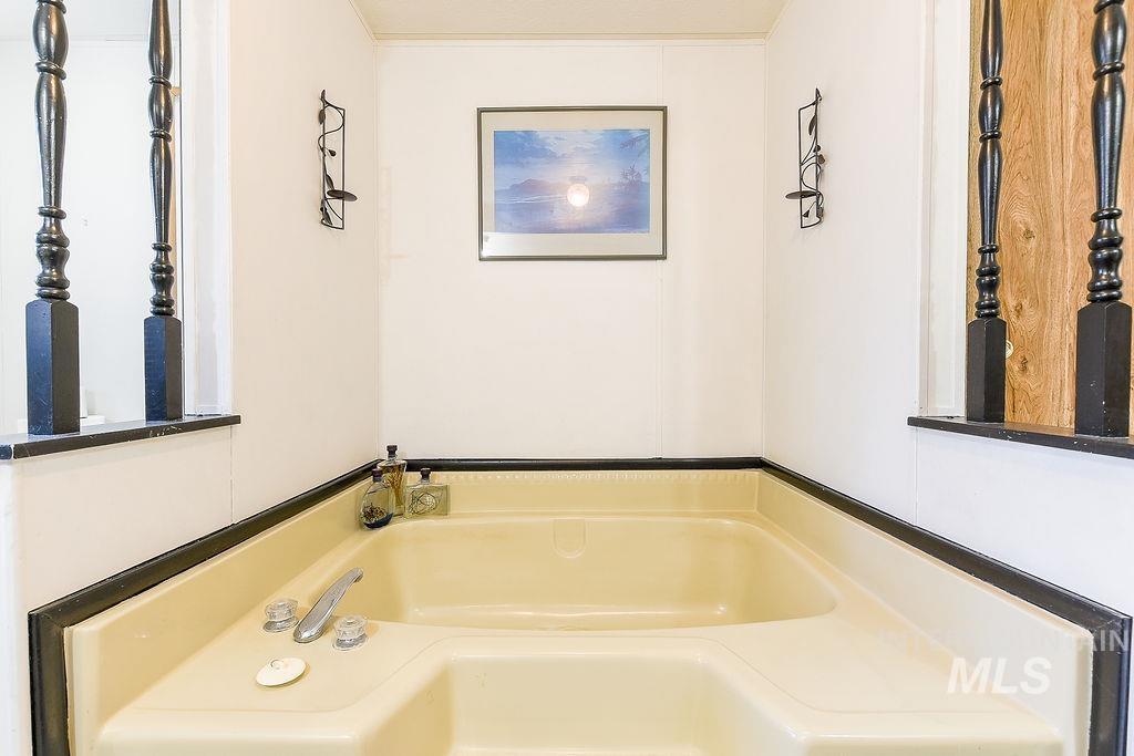 Full bath featuring a bath