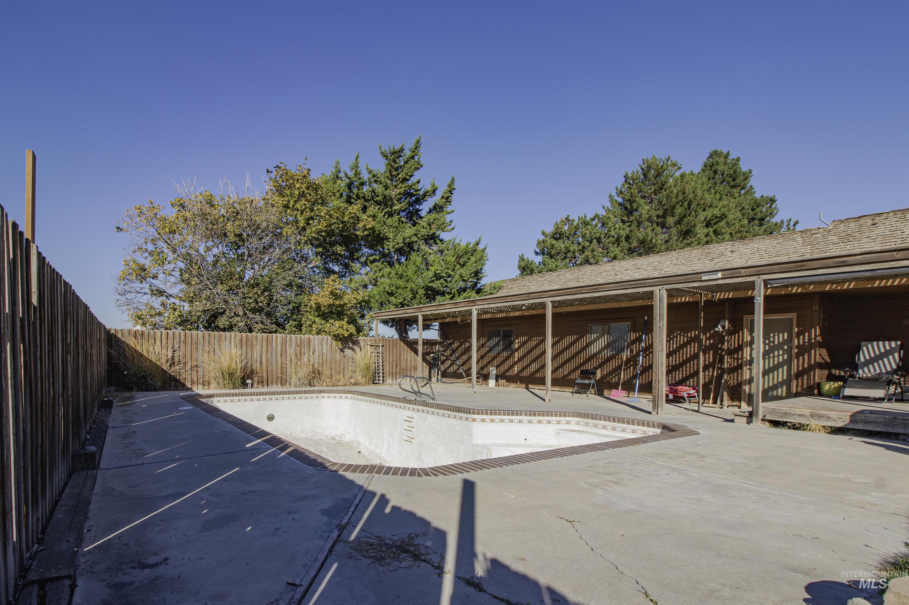 View of pool featuring a patio and a fenced backyard