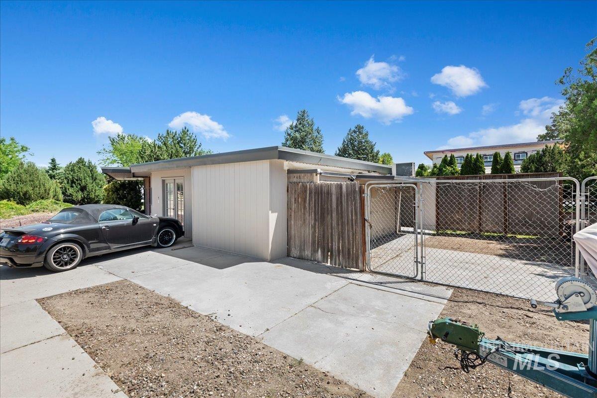 View of front of home featuring a gate