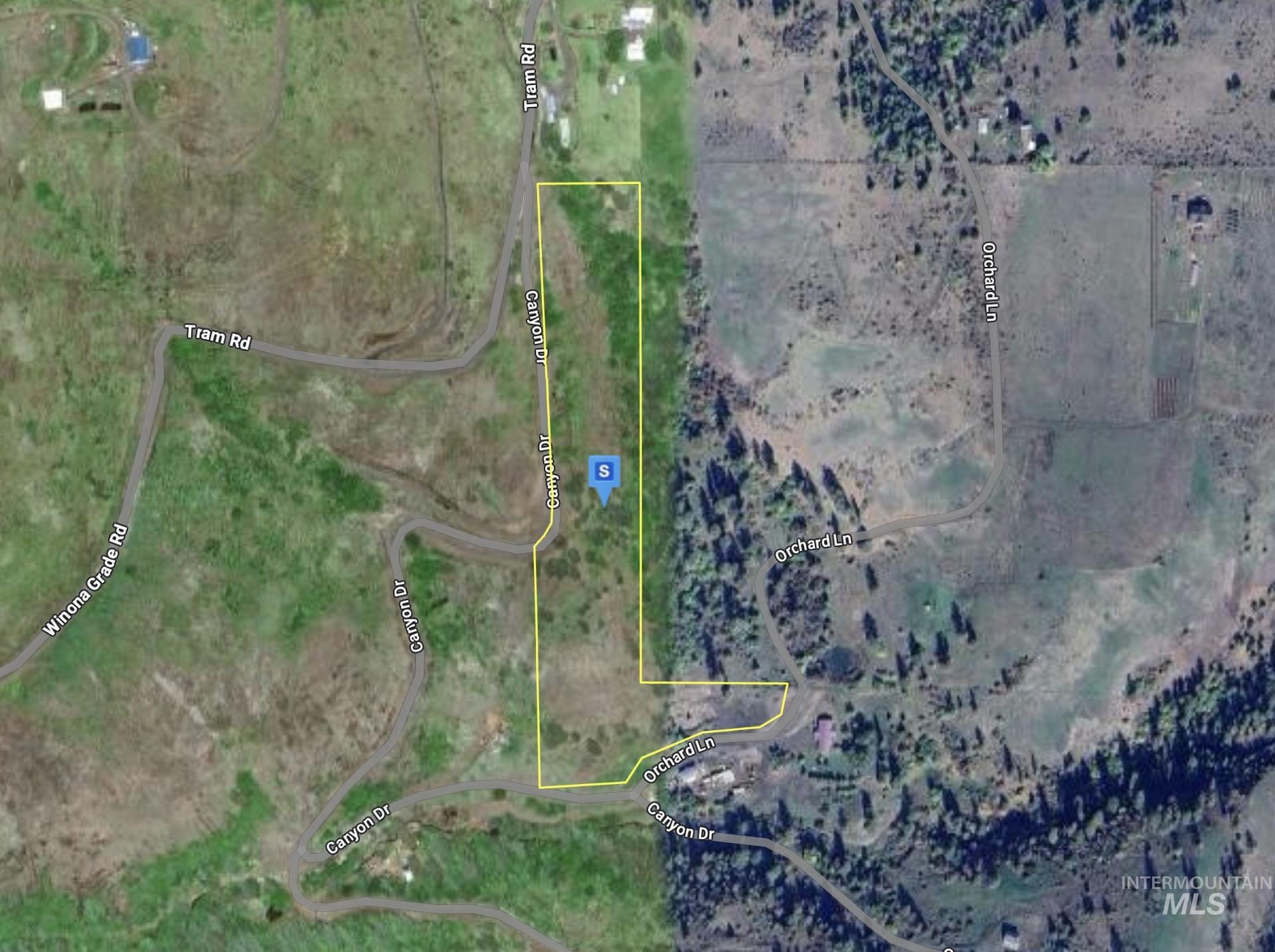 Aerial overview of property's location featuring property parcel outlined