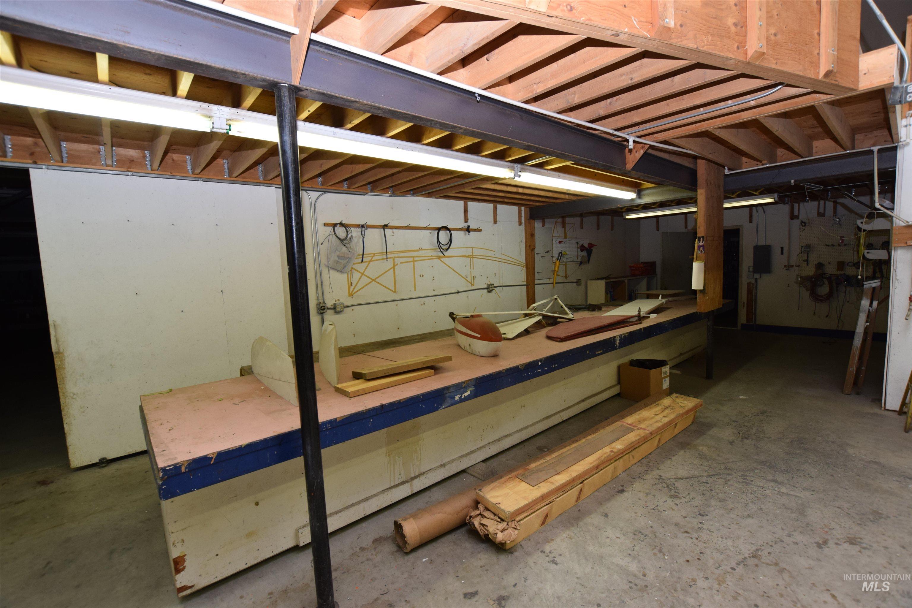 Unfinished basement with a workshop area