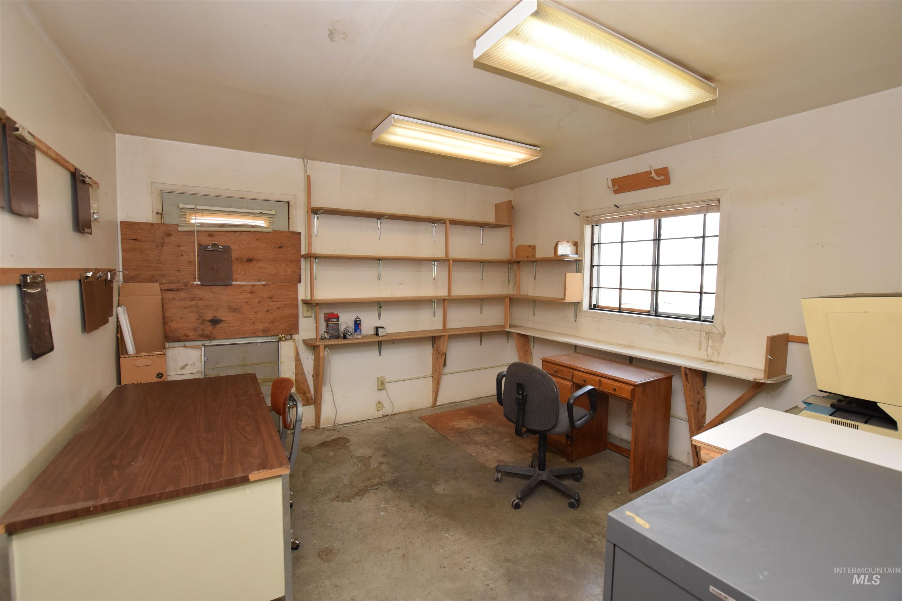 Office with unfinished concrete floors