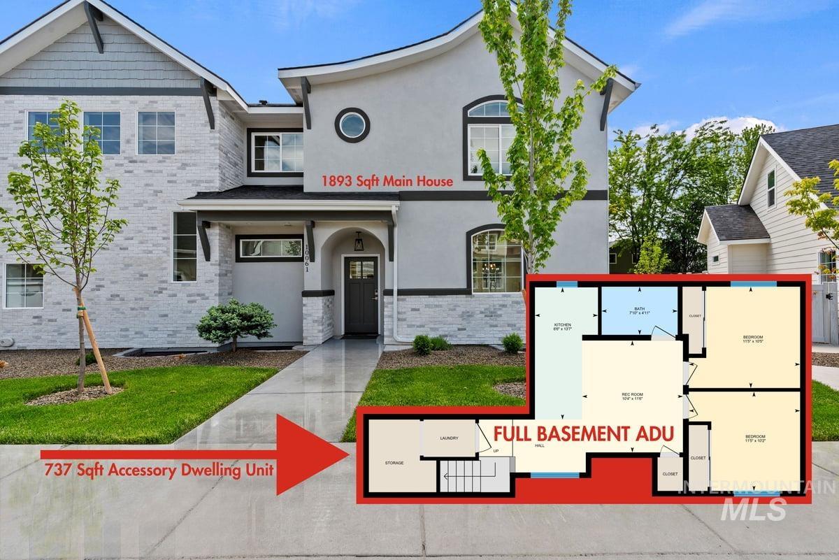 View of front of house featuring stucco siding and brick siding