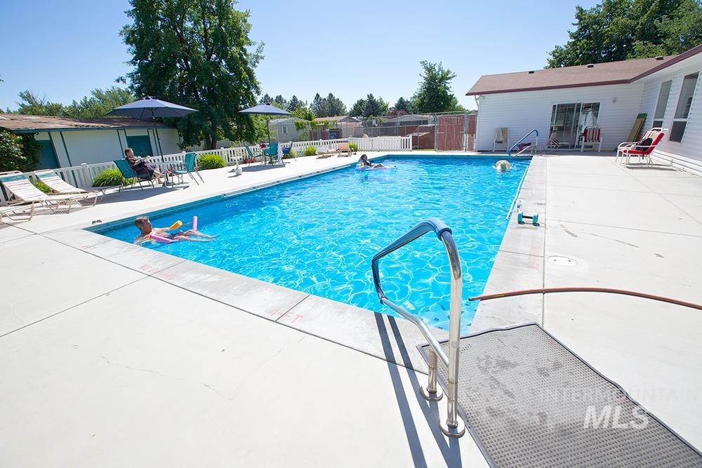 Community pool featuring a patio