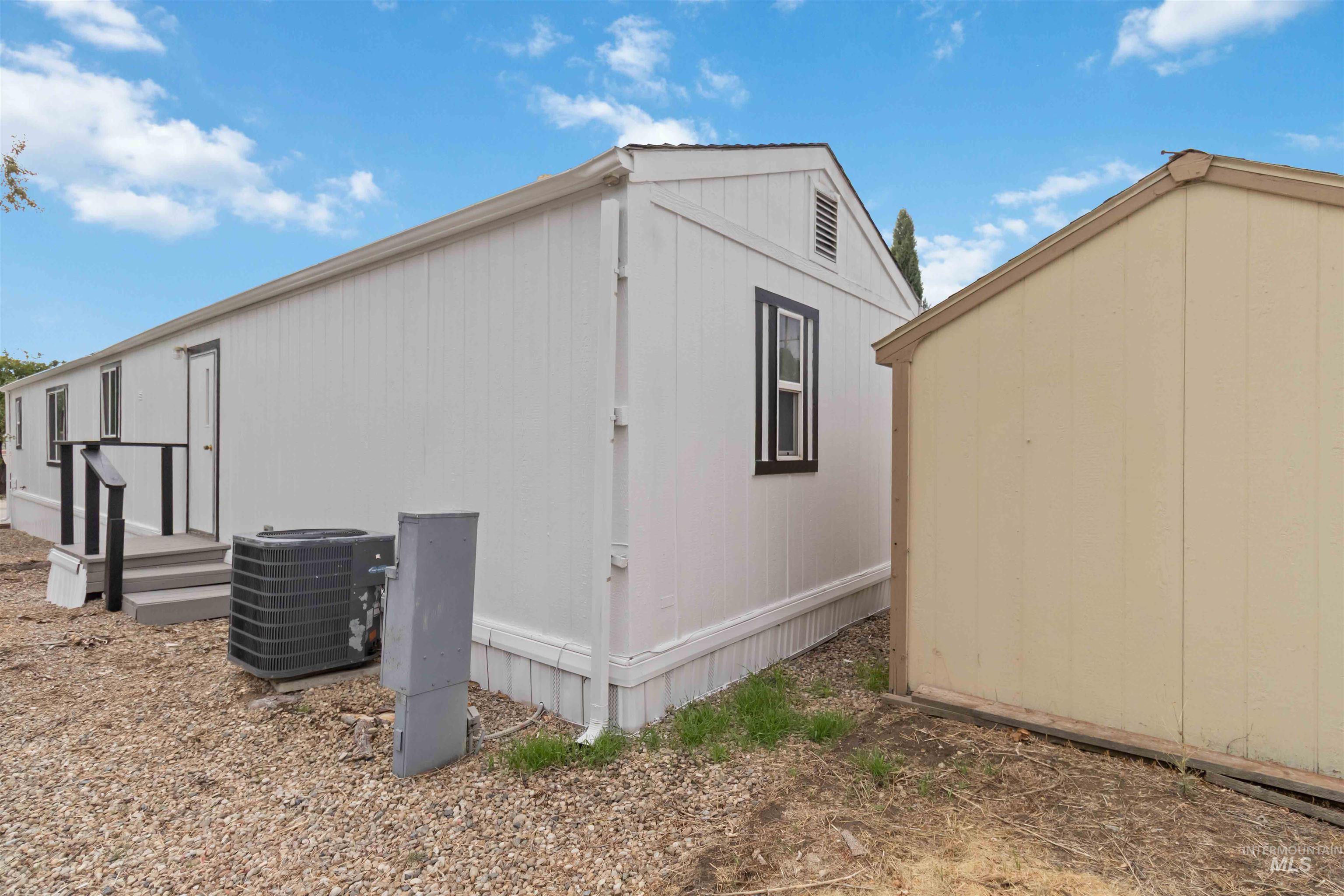 View of home's exterior with a cooling unit